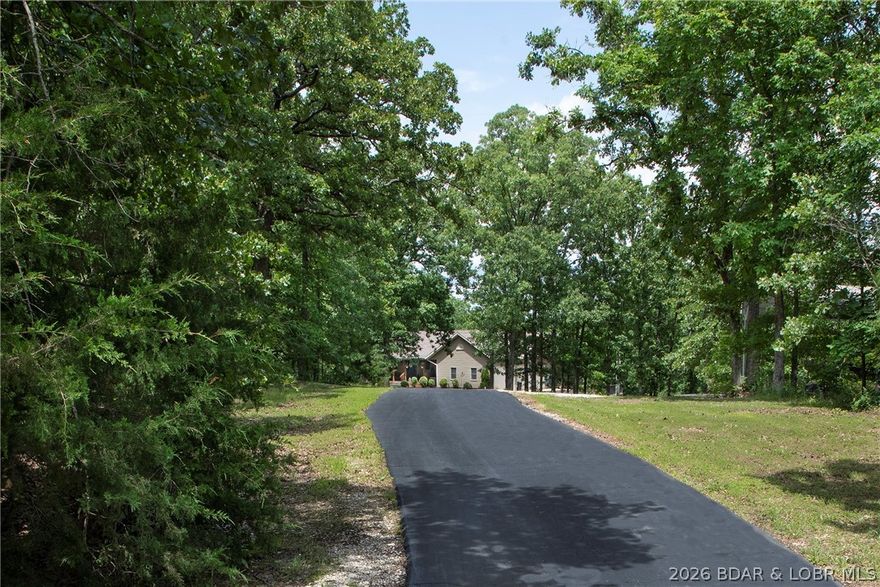 Country living on 20 acres within the city limits of Laurie. Enjoy privacy and Mother Nature with the convenience of being close to city amenities, public golf, movie theater and restaurants. This comfortable home has everything you are looking for including a private in ground swimming pool. This open floor plan features living on the entry level. The large master suite has 3 walk-in closets, his and her sinks and jetted tub. The lower level has a family room, exercise room, storage and additional bedrooms. In addition to the attached garage there is a seperate 18X27 workshop. The updated kitchen has stainless appliances, (micro is brand new), newer counter tops and custom cabinets. The main level features 2 additional bedrooms and 1 bath. The dining room walks out to a screened deck which overlooks your 16X32 pool. The perfect spot to entertain. Call for your private viewing today.
