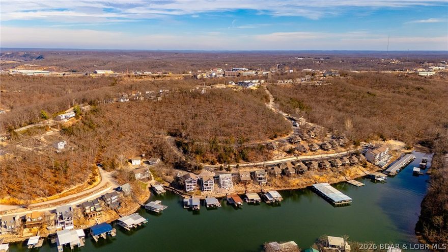 This Southern facing parcel is a very rare find at Lake of the Ozarks! Zoned C1-B Motel, Hotel, Resort, Condos or any C1-A (numerous) allowed use, giving you many development options. Located on the Northern most side of Osage Beach where shopping, restaurants and even a proposed Osage Nation Casino are located. A short shot to the historic Bagnell Dam strip and the community bridge is just a few minute drive. Offering approximately 750' of road frontage, City Sewer & Water as well as partial lake views you wont find a more appealing parcel of ground in the City Limits. Come Check out this Midwest Coast gem today!