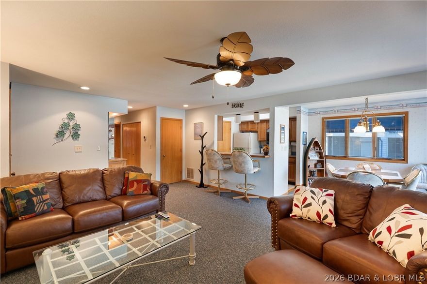 Wake up to Lake of the Ozarks every single day. This stunning 2-bed, 2-bath lakefront condo offers over 1,100 sq ft of fully furnished living space inside the gated community of Bronx on the Lake — move-in ready from day one. Bronx on the Lake is a quiet, park-like setting with lush green space throughout — a rare retreat that feels worlds away from the hustle, yet right on the water. Step onto your large screened deck for sweeping views of the pool and the lake, then wind down with an evening stroll along the beautiful lakeside boardwalk. Enjoy your own boat slip, community pool, private fishing pond, and on-site trailer parking. And unlike so many Lake of the Ozarks properties, rentals are not permitted — making this a true owner community where you'll actually know your neighbors. Peaceful. Private. Gated. Fully furnished. This is lake life the way it was meant to be. Don’t miss your chance to get a little piece of paradise!