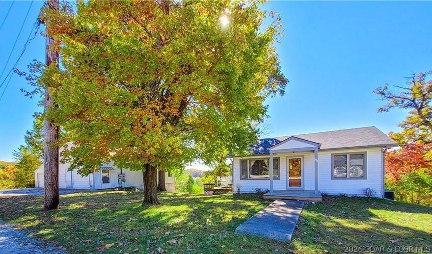 Unique and rare lake property minutes from restaurants, shopping, golf and entertainment. This half acre property has a 2 BD, 1 BA house with a basement and huge deck. There is also a 1650 sq ft 3 bay shop, with a full kitchen and bath, as well as a small bedroom and a large covered deck overlooking the lake. The house is currently occupied by a full time tenant who can vacant with 30 - 60 day notice. There are no restrictions on this property. Use the shop for a business, garage, secure boat/RV storage (two 41’ x 14’ bays with high doors and 26’ garage), or a giant man cave! This would also be perfect property for building a new home of your dreams overlooking the lake. So call today, because finding a half acre on the lake so close to everything, and with no HOA or restrictions is almost impossible. So many possibilities… this won’t last!