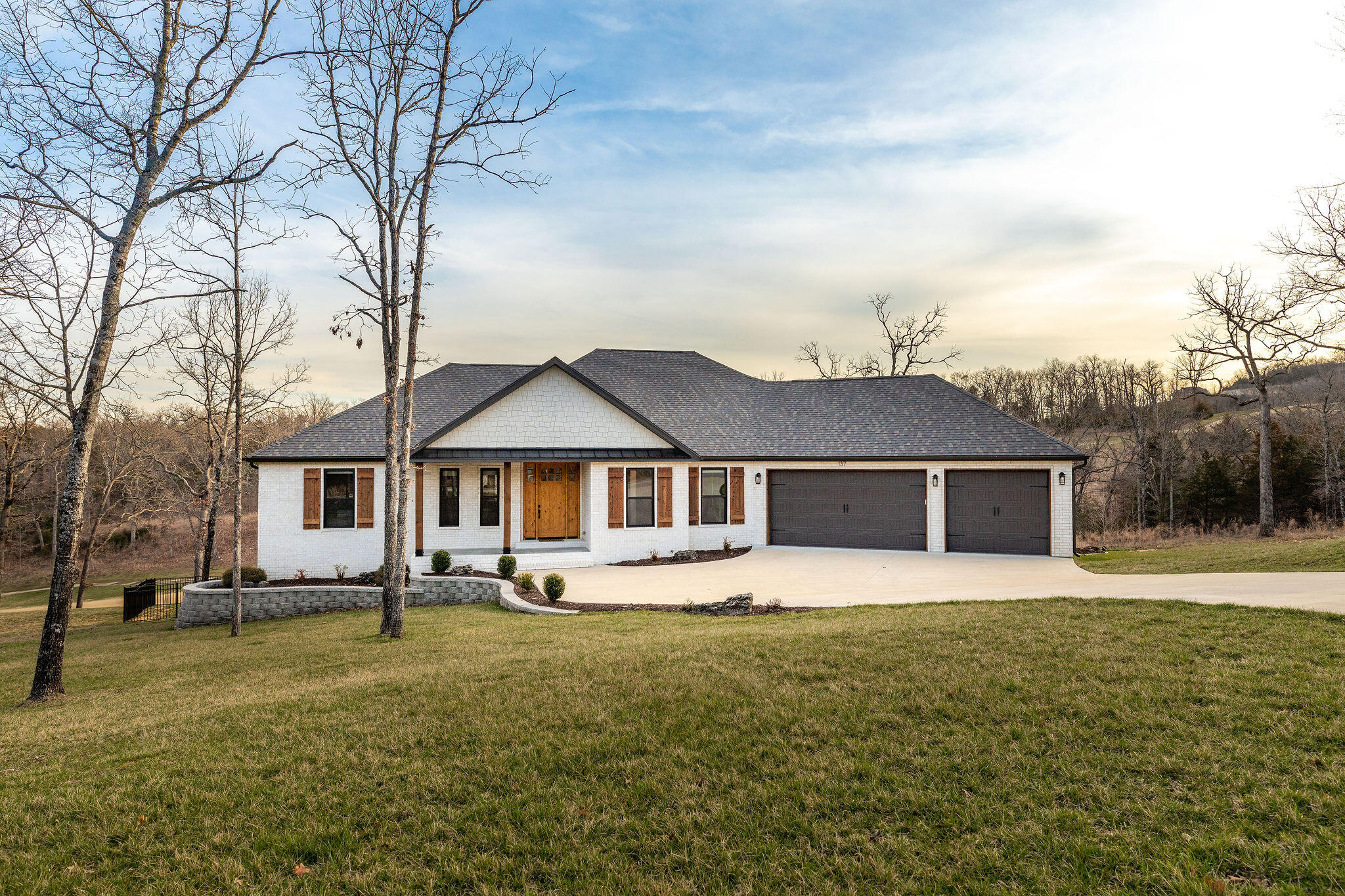 Imagine moving into a house where nothing needs done! You will not be disappointed with this 5 bedroom/3 bath brick home, featuring 2 dining and 3 living areas. There are plenty of custom features including quartz countertops, large kitchen island, signature wood beams, custom black-out shades, extra large bedrooms, lots of storage and even a storm shelter.  Enjoy the Ozark's evening air, sitting on your back porch, in a top of the line saltwater hot-tub overlooking the award winning Branson Hills Golf Course. Amenities within this gated  community, include access to tennis courts, swimming pool, clubhouse, and discounts for golfing. Voted #1 Golf Course to play in Missouri by Golfweek Magazine 2012-2018. You will appreciate how conveniently located this home is to shopping, schools, hospitals and HWY access. Call now for your private showing.