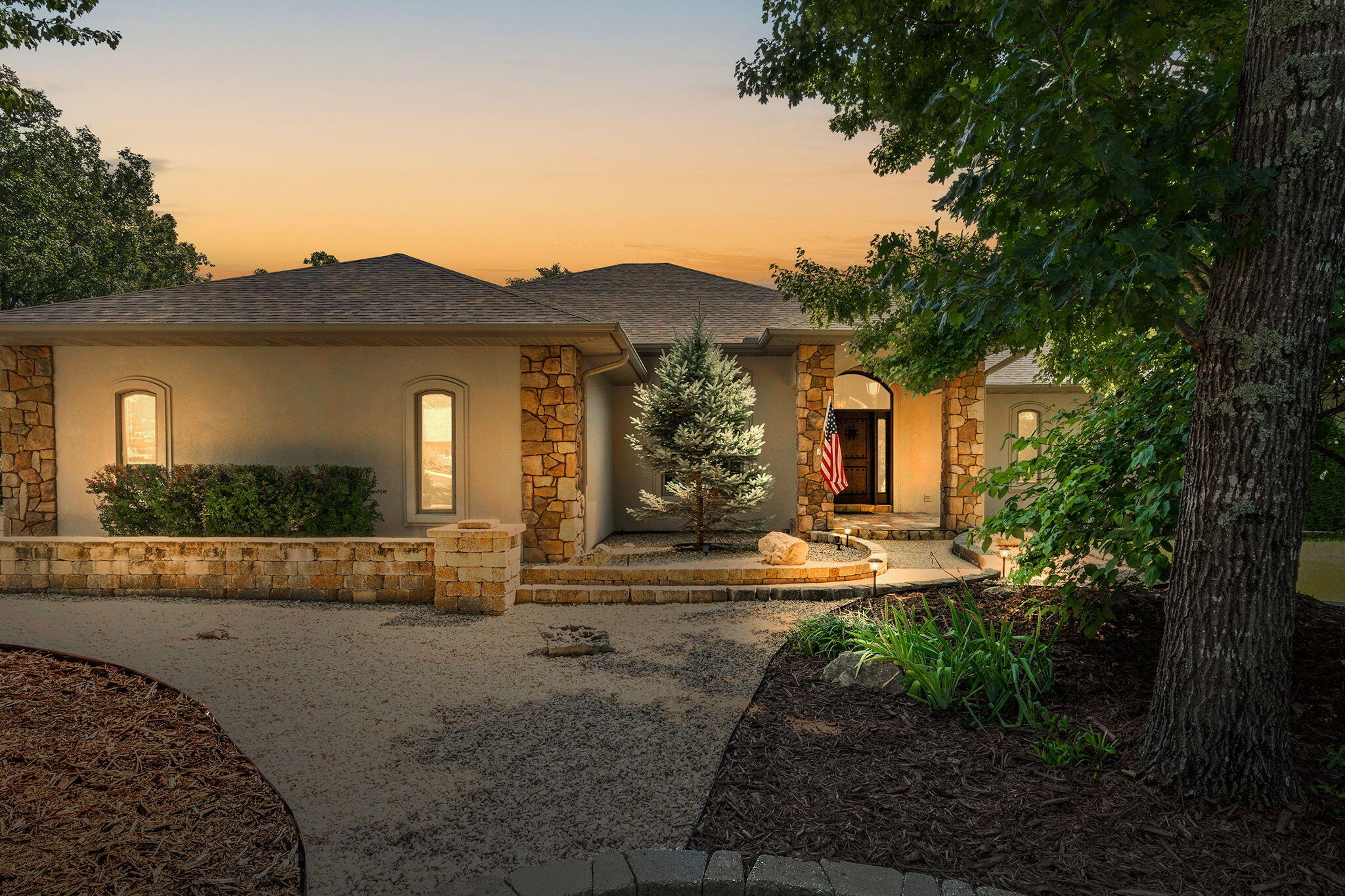 Stunning 3 bed/3bath home in the gated StoneBridge Village community!  Overlooking Ledgestone's 15th hole on the golf course, behind a 2nd set of gates, this property offers a NEW roof (2022), granite counters, bamboo flooring, a safe room, whole house generator, multiple decks to take in the amazing view, and so much more!  From the tiled entryway, discover a formal dining room, and a living room with built-in entertainment center, stone fireplace, and open floor plan to the kitchen.  Kitchen features maple cabinets, tile backsplash, stainless appliances - including a gas cooktop on the island with a hood, and attached dining room with bay windows.  Primary bedroom suite features an attached sitting area with gas fireplace, private deck, his/hers sinks, bathtub, walk-in shower, walk-in closet, and laundry room.  Main level has one more bedroom and a full hall bathroom.  The basement includes amazing entertaining space with a 2nd living area, pool table room, the 3rd gas fireplace, ample storage w/ an F-5 safe room, room for 2nd laundry area, and another bedroom + bathroom.  Home includes over 1000 SF of covered deck space, 2x6 construction, an oversized 3 car garage, 1000 gallon buried propane tank, 2 tankless water heaters (one replaced 2023), and double zoned HVAC!  StoneBridge Village is a gated golf community located just west of Branson, Missouri on Highway 76 near Silver Dollar City.  The POA owns and operates the LedgeStone Grille, 18 hole LedgeStone Championship Golf Course including a full golf practice grounds, the 27,000 sq. ft. LedgeStone Clubhouse with a 5,000 sq. ft. banquet facility, community swimming pools and playgrounds. In addition, the POA maintains the roadways (currently 19.3 miles paved) and the common grounds within the village.  Call to schedule a tour today!