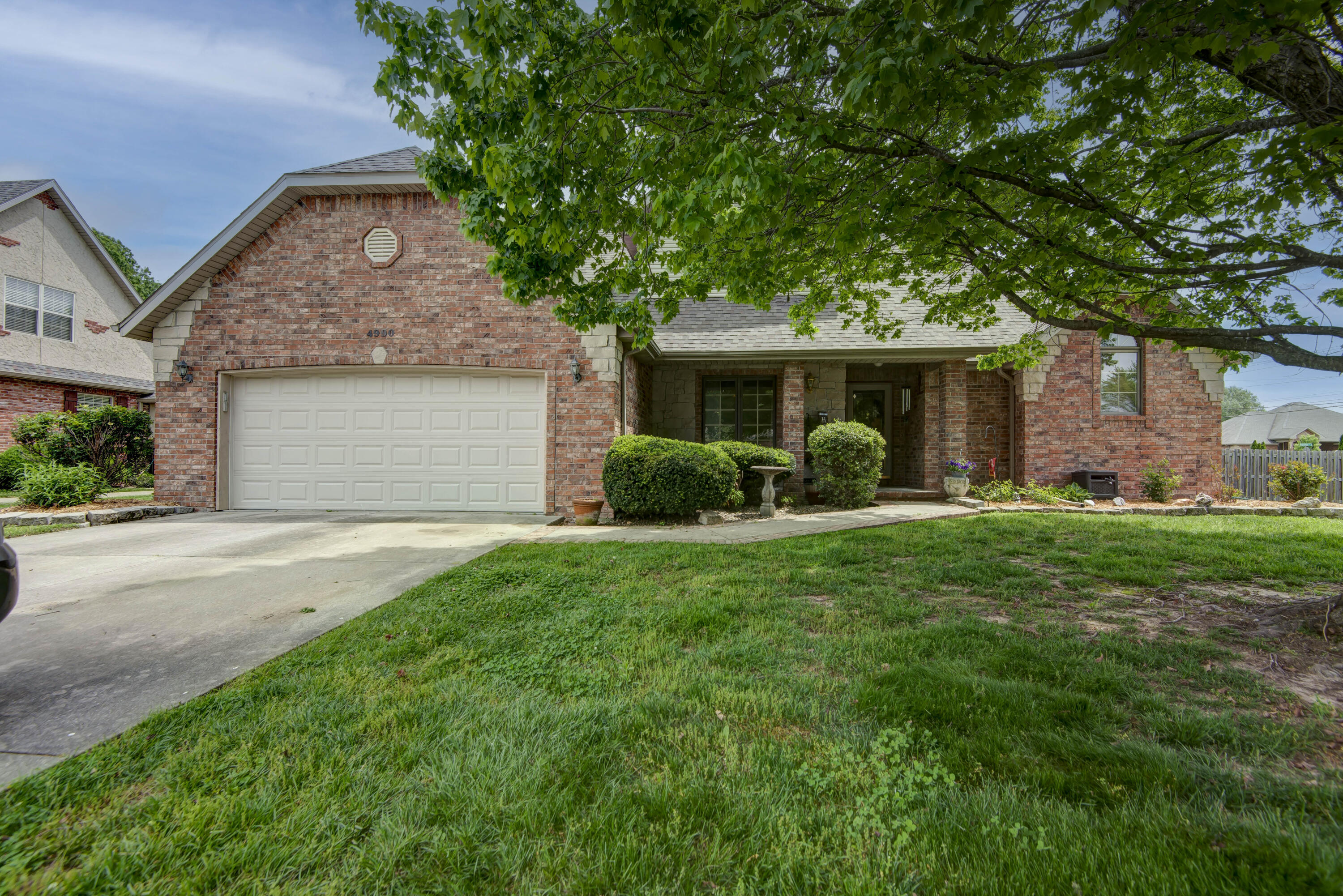 When an outdoor oasis and traditional upgrades collide, you get this 5 bedroom home with a warm flair that hugs you as soon as you walk in the door. From the stunning hardwood floors to the soaring living room ceilings, you'll appreciate the care and detail that has gone into this home. Whether you're a true chef or simply aspiring to be one, this beautifully remodeled kitchen will bring out your inner 'Emeril' with expansive granite countertops, newer stainless steel appliances, and ample storage. Your large master retreat gives a hideaway complete with walk-in closet, dual vanities, jetted tub, and walk-in shower. Upstairs has the additional bedrooms complete with a 5th bedroom currently being used as a theater/game room. Your outdoor oasis features a huge nearly half acre corner lot which is fully fenced, garden area, and adorable pergola to provide some cover for the sunset dinners on the patio. Other perks of this property include: a see through gas fireplace, formal dining room, irrigation system, storage shed, newer AC and furnace (2020), newer roof (only 4 years old), and a convenient location within walking distance to schools. The neighborhood provides trash service and a pool you can enjoy this summer without having to take care of it yourself.  ;)  So if you're looking for a home that has been loved and well maintained, you won't find a better option than this!