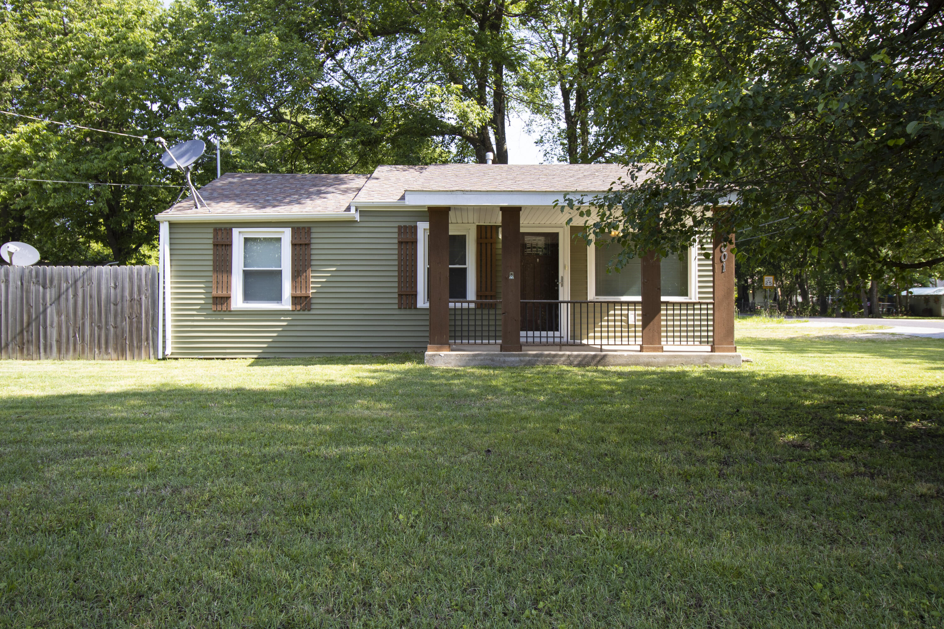 Updated in 2017, curb appeal is the key to this cozy cottage home.  Cedar beams frame the covered front porch & are effortlessly complemented the matching shutters & updated vinyl siding.   It is reported that this 2 bedroom 1 bath home was stripped down to the studs in 2017 & was totally rewired, with new insulation, drywall, flooring, fixtures, paint, HVAC, a new roof - new everything. Beautiful white kitchen cabinetry, stainless appliances & a seemingly open floor plan serve as the focal point in the common living spaces. The private back yard backyard & matching storage building invite you to explore a variety of hobbies: Cookouts, gardening, or even a slightly overly competitive Cornhole game...  You know who you are.   This is the place!