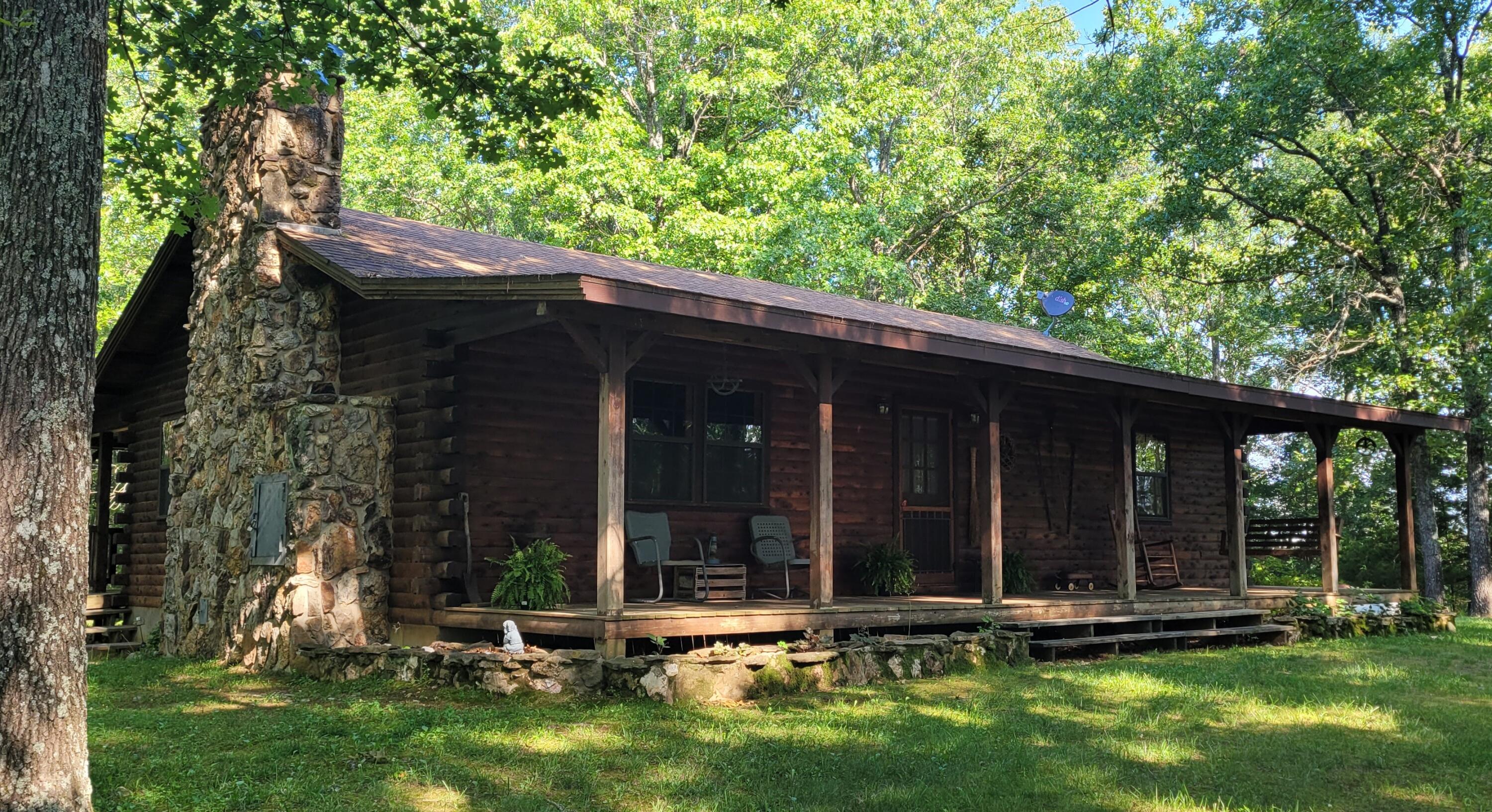 Attention Buyers - Priced $25,000 below appraisal. Appraisal is available upon request. Completed on 6/07/2024Complete privacy and seclusion yet still being close enough to local shops, schools, and amenitiesGet away from the hustle and bustle of town with this stunning property nestled on 5 acres. Featuring a McKee built cedar log home with a full finished walkout basement. Open kitchen living room area with a large wood burning stone fireplace.  Spacious primary bedroom with large closets. Main floor laundry room. Home has been well cared for and maintained.  Front and back decks extend the length of the home for plenty of space for entertainment.Detached Garage/Shop present concrete floor, 220 electrics, living quarters with 2 bedrooms and bathroom with composting toilet. Storage above the living quarters with stair access. Several updates including new roof and HVAC in 2013, new water well pump, pressure tank, and water heater in 2022. All of this is situated on 5 wooded acres m/l offering privacy. Amazing property! Call for a showing today.