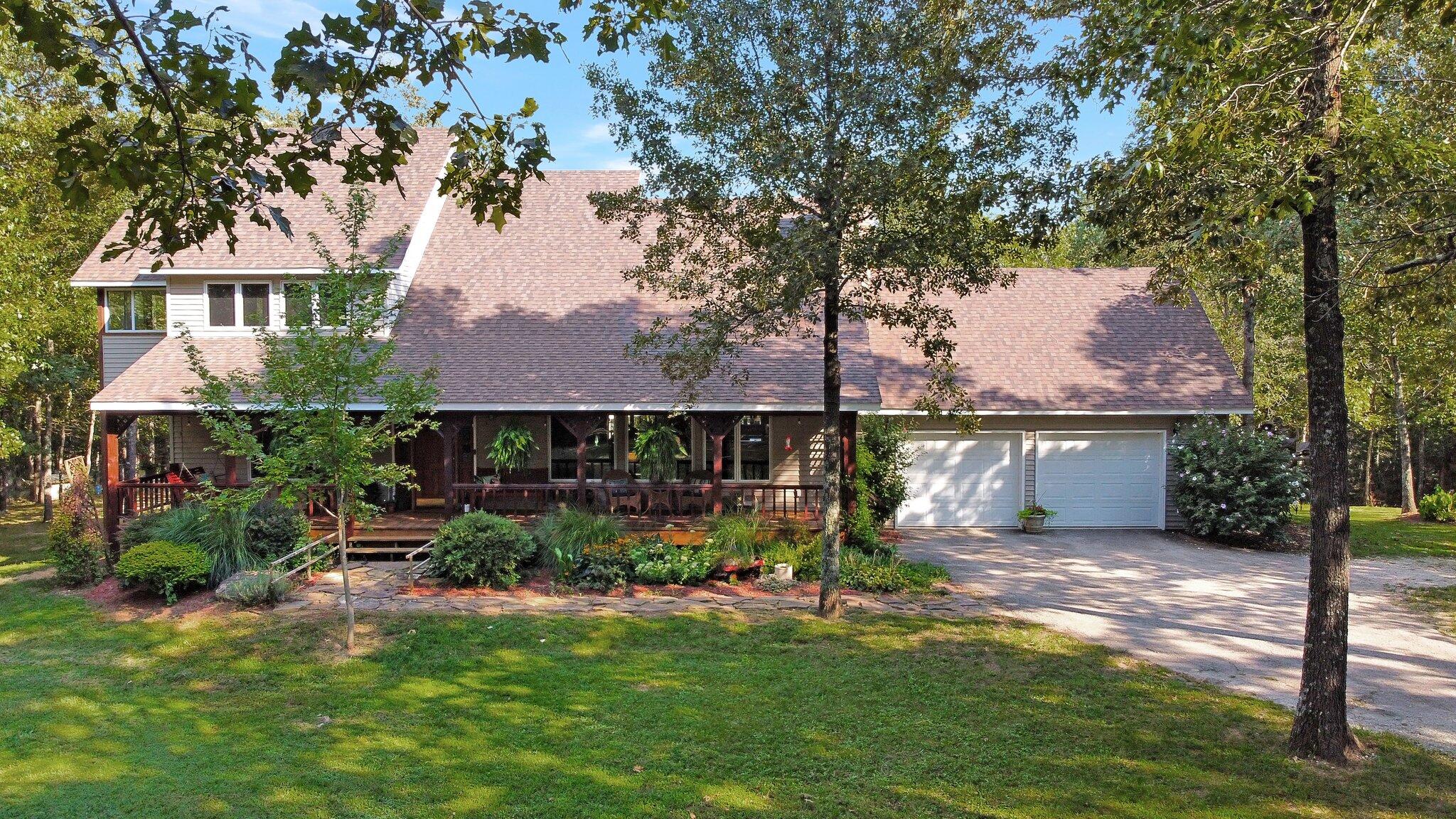 Beautiful custom home on 28 acres in Howell Valley School District.  This 5 bedroom 3 bath home nestled among28 acres is a must have.  Need a shop?  30x30 shop with concrete floors and electric as well as 12 ft overhangs on each side!  The home features vaulted ceiling and an open concept with lots of natural lighting.  Enjoy your master suite secluded on the second floor with your own private sunroom!  The loft area is the perfect place for your home office.  Relax on your covered front porch and enjoy the scenery. The back covered deck is the perfect place to watch the vast wildlife and catch the bass jumping in the pond.  If a mother in law suite is what you're looking for; look no further.  The completely finished basement with private entrance will not disappoint.  Enjoy nearby lakes and rivers as well as top rated medical facilities, shopping and dining!New Roof with 50 yr shingles.New Flooring, paint and fixtures.