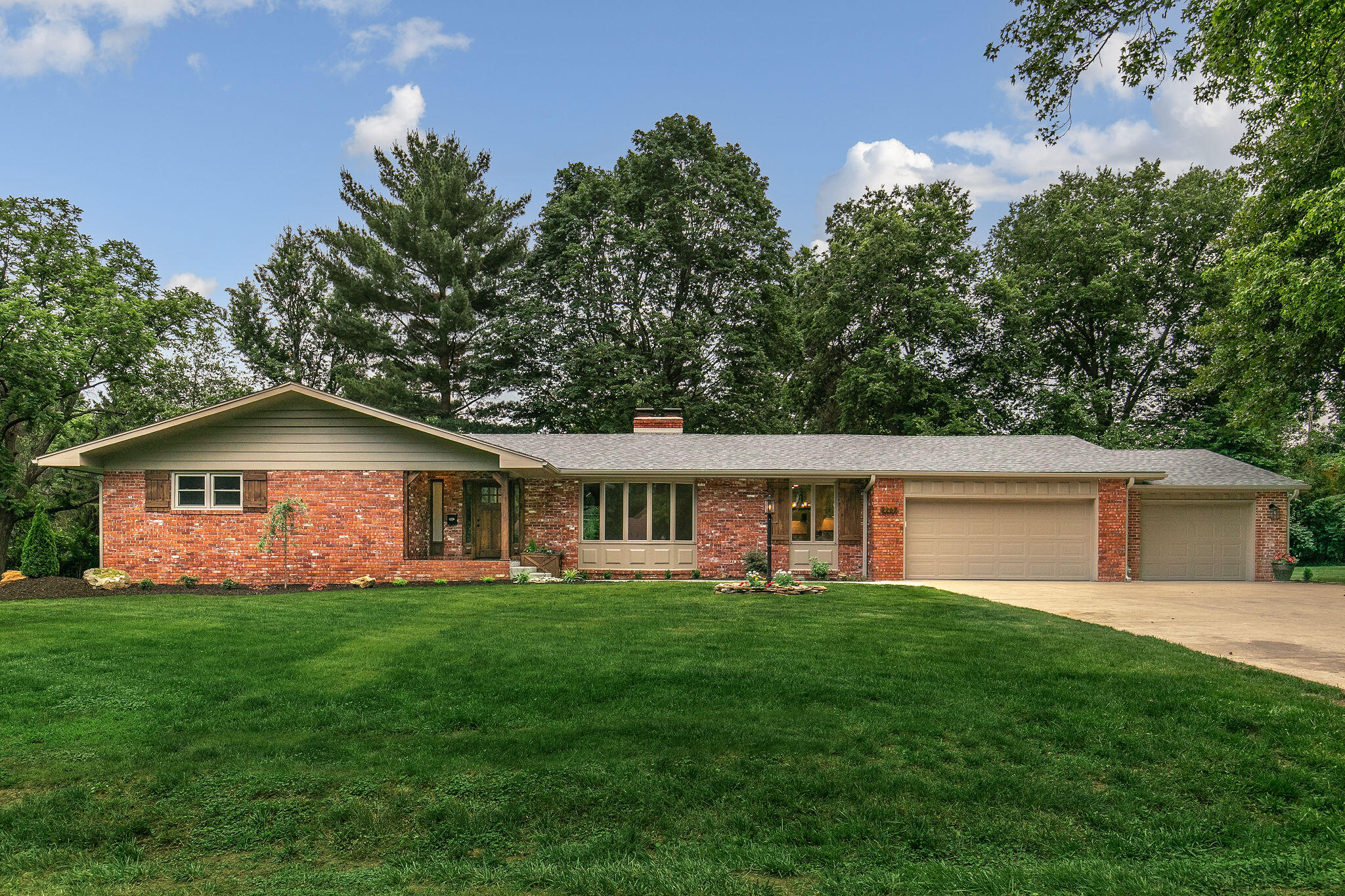 Incredible home in highly desired East Springfield area. This home will impress from the moment you walk in the door. The main level features a great open floor plan with large brick fireplace, walls of windows and hardwood floors throughout. The dream kitchen boasts beautiful white cabinets with huge black center island, granite countertops, farmhouse sink and tile backslash. Brand new stainless steel appliances including microwave, dishwasher, gas range and pot filler for easy cooking. Truly an entertainers dream. The main floor includes a master bedroom with resort like ensuite bathroom. Dual sink vanity, soaking tub and large walk in shower. There are 2 additional bedrooms and another impressive bathroom with walk in shower, impressive vanity and tile work. The oversized laundry with drop zone rounds out the main floor. Making your way to the basement you will find a huge living space with so many options. There is a large 4th bedroom, perfect for guests or older children and another impressive bathroom with walk in tile shower granite counter tops and impressive tile work. Additionally there is unfinished space providing great storage.Sitting on 3/4 of an acre this home offers a park like setting with a nice patio, mature trees, and gazebo. Fritz Lane area (backs up to Fritz Lane homes) Essentially this is new construction with all new wiring, plumbing, interior walls, insulation, switches and outlets, fixtures and appliances. This  home will not last long, call for your private tour today.