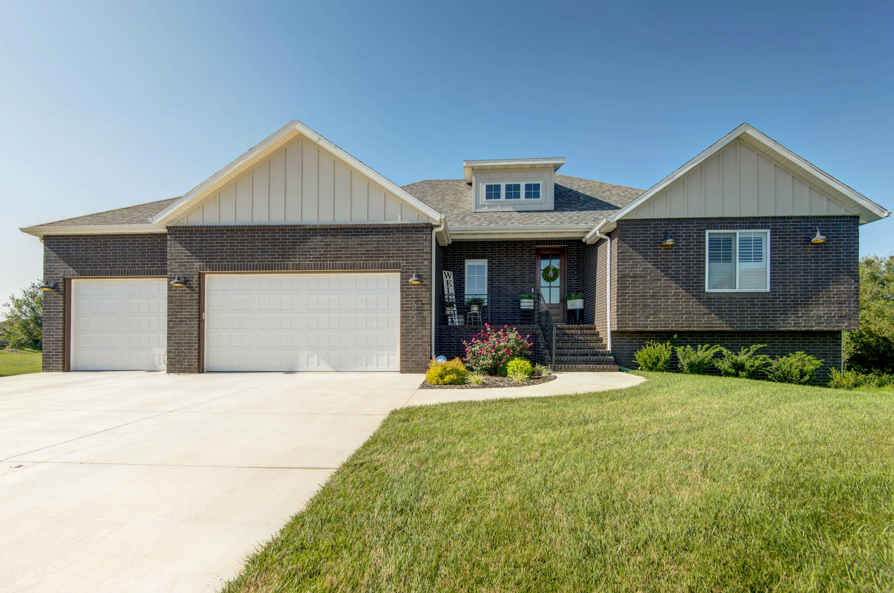 Prepared to be impressed!  This like new home is a rare find on over an acre lot (1.084 M/L) in east Springfield!  Located on a quiet cul-de-sac in desirable Hickory Valley Subdivision it features: 4 bedrooms, 3 full baths, 2 living area, screened in porch, wet bar and 3 car garage. The main floor features open floor plan with large living room with gas fireplace, gourmet kitchen that features: quartz counter tops, subway tile backsplash, large island with bar seating, farm sink, walk-in pantry and stainless steel appliances that include gas stove with double ovens. Kitchen dining area with access to the screened in porch.  Large master ensuite with accent wall, double vanities, tile walk-in shower, soaking tub and walk-in closet. The main floor has 2nd bedroom, full bath and laundry room. The basement has living area with wet bar/kitchenette, 2 more bedrooms, a full bath with double vanities, storm shelter, lots of storage and a John Deere room. Lots of quality features including metal handrails and more! Beautiful hardwood floors in entry, living room, kitchen, dining and master bedroom. Tile in bathrooms and laundry.  Carpet in all the bedrooms.  Luxury vinyl in basement living area. Covered front porch and large covered back patio. Call today for your private showing!