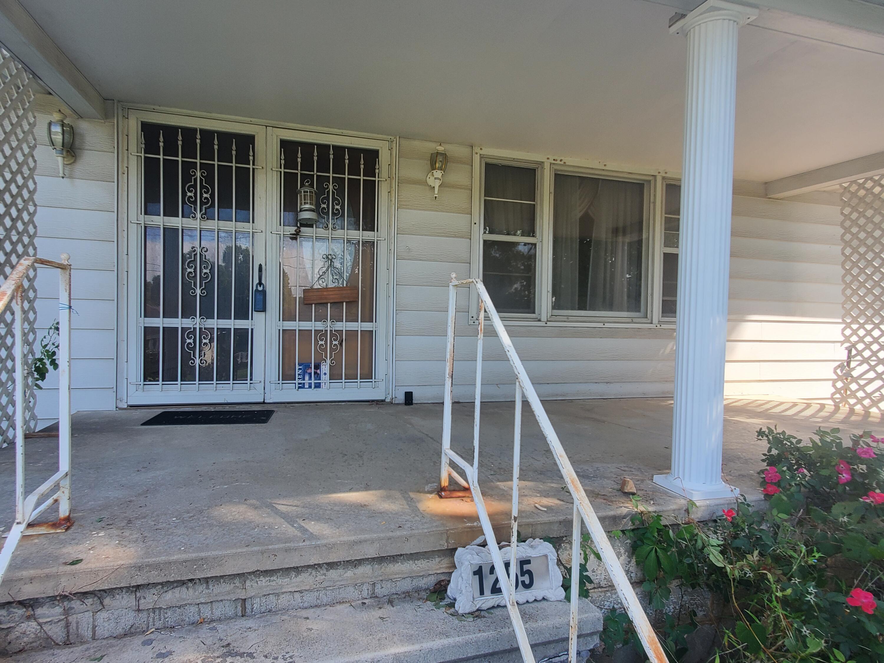 Great location! Resting on a Corner lot N of I-44 on east side of National . Appr 1500 SQ Ft living area with attached 2 car gar AND attached 2 car-carport.. Sold 'as is' with no repairs. 3 BR, 2 Ba, covered, enclosed back patio. Buyers to perform due diligence; Seller has never occupied, has no knowledge.