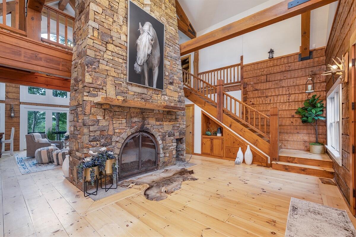 Captivating custom home in Saddlebrooke with separate  guest home!  This is truly unbelievable property and has been beautifully remodeled to a very high standard.  Sitting on 26+ acres w/ magnificent view of Mark Twain National Forest.  The Dancing Bear Ranch offers a separate guesthouse, one of a kind in-ground pool, private turn around circle drive, and an incredible horse barn with 4 stalls just for starters.  There are numerous spring fed ponds and a spring fed creek that runs behind the stable.  Please note that the home is situated in the Village of Saddlebrooke but is not part of the subdivision!