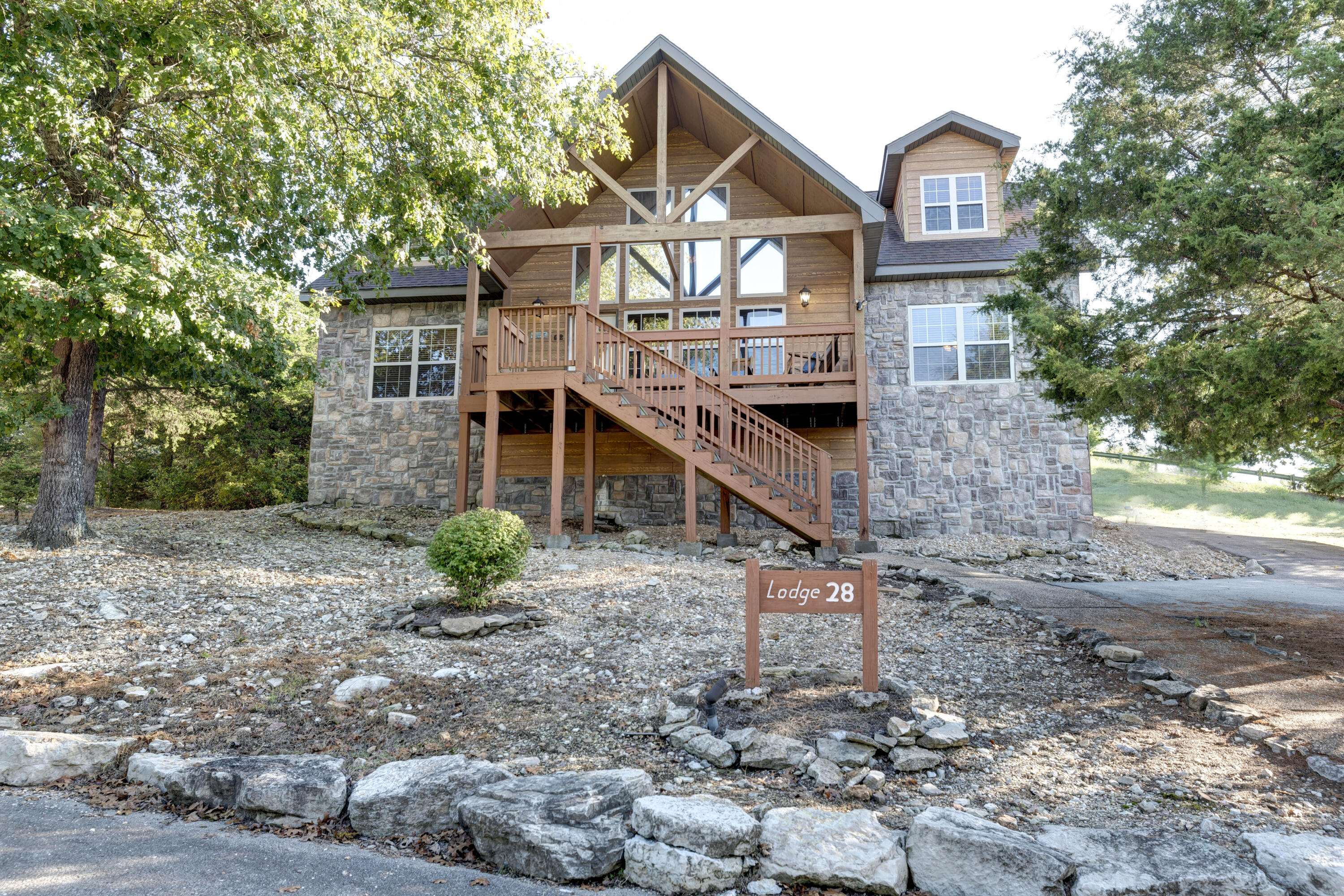 One of the most unique Lodges in Stonebridge! Asphalt driveway to allow for WALK IN at the rear entrance. LOTS of off street parking and beautifully FURNISHED with a successful rental history! See Features attachment for all the upgrades. P&L shows almost $70,000 NET income for 2022. Stonebridge is one of the few area resorts that allow self-management for short term rental. GREAT STR investment or use as personal residence. Stonebridge amenities include multiple pools; clubhouse with restaurant/bar; exercise rm; tennis courts; pro shop; Ledgestone golf course & MORE!!