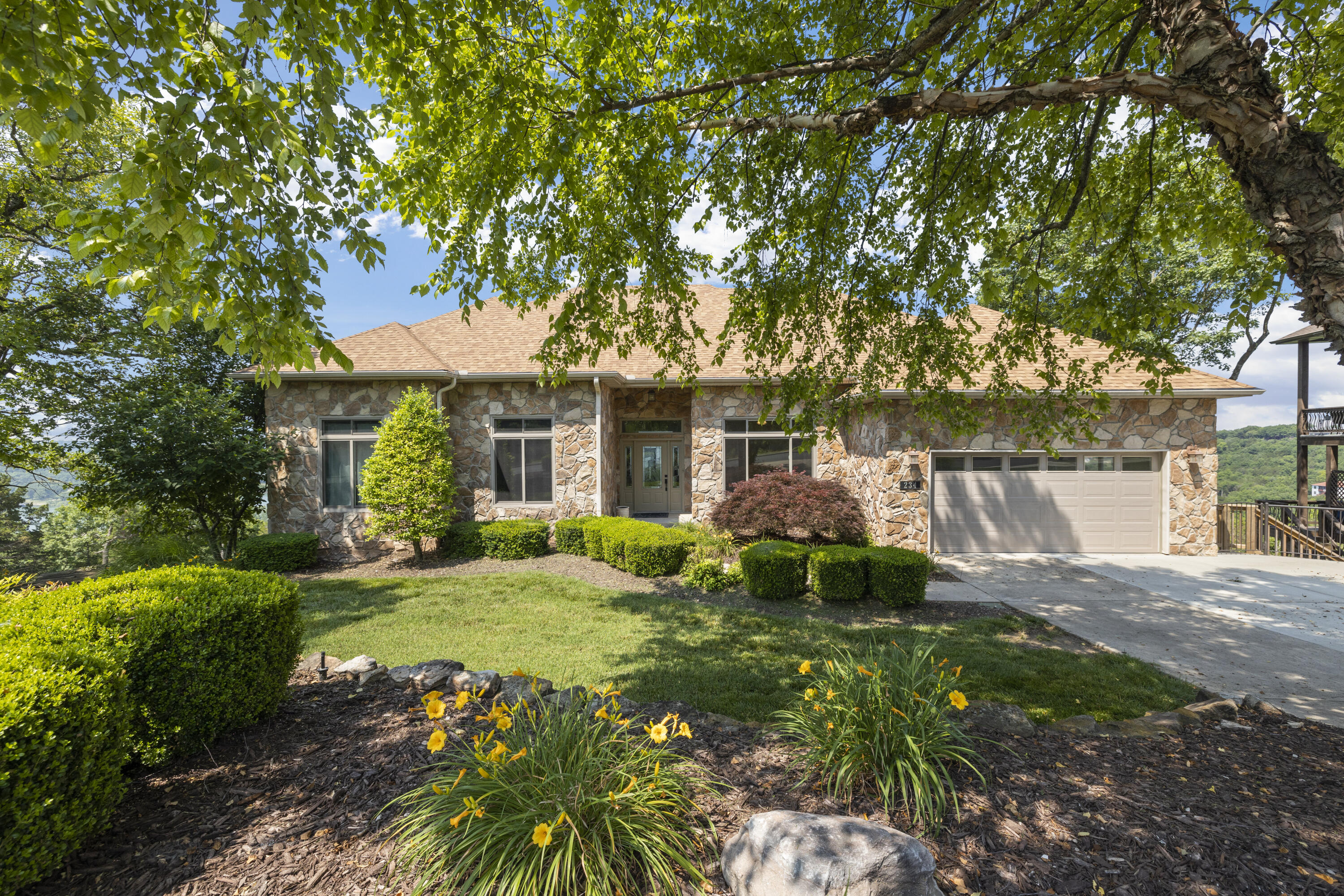 WOW!!! This is the ONE You Have Been Waiting For!!! SPECTACULAR Table Rock Lake Views that Go on Forever!  Located in the Prestigious, Gated Emerald Pointe Community. The Chef in You Will Delight in the Spacious Kitchen with Center Island Where You Can Cook with The Lake as Your Backdrop.  The Living Room Gas Fireplace is the Perfect Spot to Cozy Up with a Good Book and Take In the Lake Views. Main Floor Laundry. High Ceilings Throughout. The TWO Covered Decks are Sure to be the Perfect Gathering Place for Everyone, Enjoying the Lake Views, and the Perfect Spot for Morning Coffee & Evening Relaxing with the Most Spectacular Sunsets Imaginable.....AND You Will Have a Front Row Seat to the Fireworks & the Branson Belle Crusing the Lake.  The Lower Level Features a Large Family Room with Wood Stove, Deck Access, Full Bathroom and Two Rooms that Could Easily be Converted into Conforming Bedrooms, Giving You Even More Room For Everyone to Spread Out.......Plus Plenty of Storage.  Just Wait Til You See the Wonderful Finished Storage Area in the Huge Crawl Space... Gorgeous Landscaping & Sprinkler System. Don't Wait to Call Emerald Pointe, ''The Crown Jewell of Table Rock Lake'' Your Home. You'll Enjoy Beautiful Lake Views, Sunsets, Marina that Offers High & Dry Service & Storage w Courtesy Dock, Boat Ramp, Clubhouse, Pool, Tennis Courts. Emerald Pointe has Quick Highway Access & is Conveniently Located to Dining, Shopping, Entertainment, Medical Care, etc. Branson Airport is a short drive, along with several of the Top Golf Courses in the USA - Top of the Rock, Buffalo Ridge, Payne's Valley. Big Cedar Lodge, Branson Landing, Silver Dollar City, and All the Entertainment & Shopping Branson has to Offer is Within Minutes! Third Party Boat Slips Available. Hurry, You Won't Find Another Home that Offers So Much!