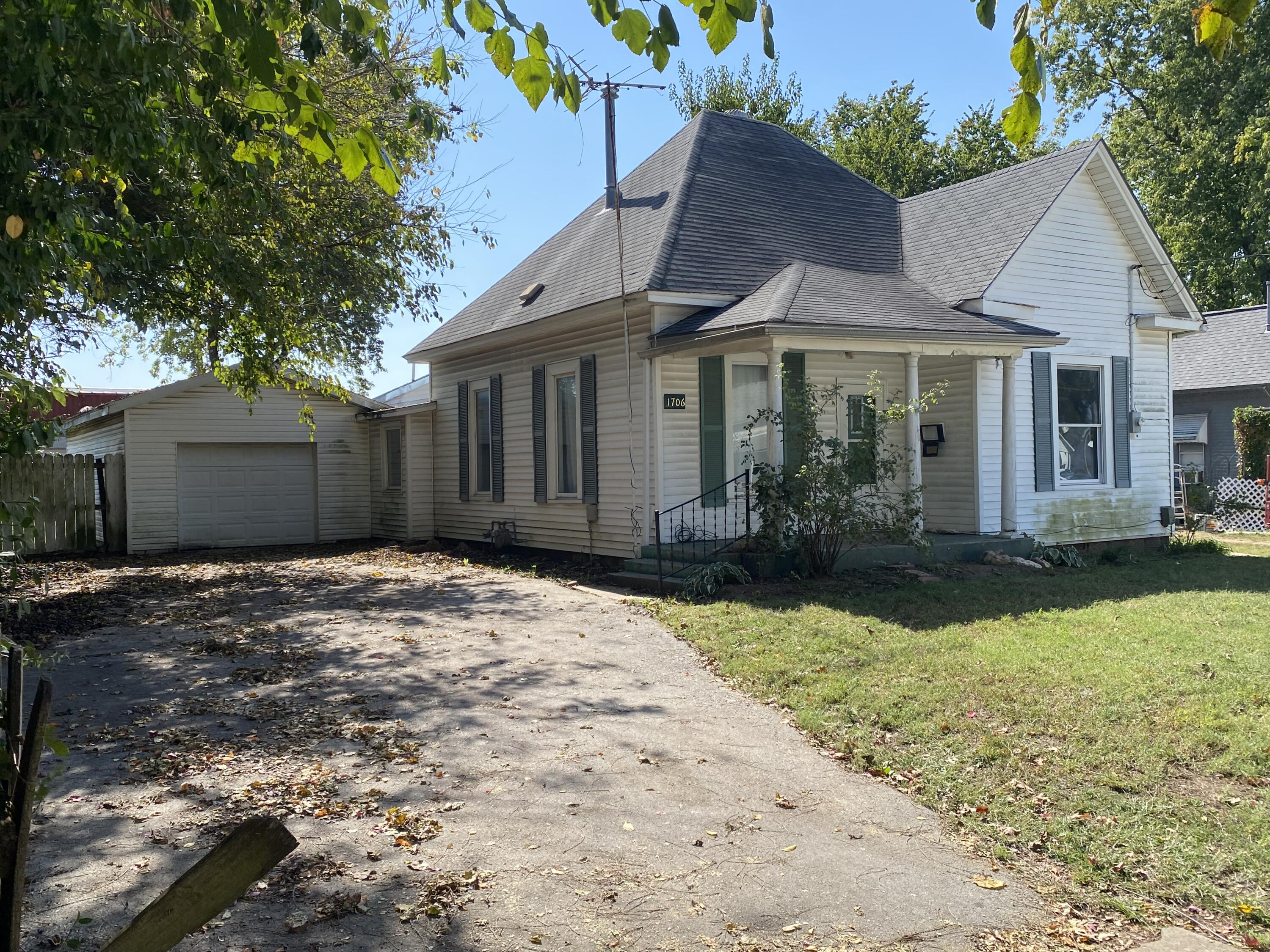 2br 1ba with Garage!  Could easily be a 3 bedroom!  This house has lots of potential!  To the side of the Living room is French Doors that open into the 1st bedroom!  Straight thru the Living Room is a large Dining Room!  To the side of the Dining Room is the 2nd Bedroom, also a good sized bedroom!  Straight thru the Dining Room lead into the Kitchen!  Off the Kitchen is a Muddroom that walks out the the backyard!  To the Side of the Kitchen and down a short hallway is a good size Bathroom!  At the end of that hallway is a Long room, to one side is the washer & Dryer hookups and a closet with hotwater heater, and the other side of the room could be used as a 3rd bedroom!  This room also walks out into the backyard!  House does need some work as can be seen in the pictures.