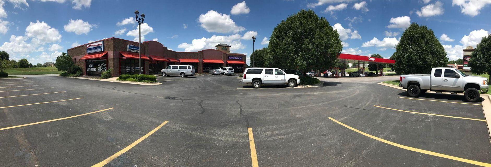 Nice, all brick strip center at W Kearney and West Bypass. Has paved parking lot with 20+ parking spots. Large Pole Sign.  Approx. 15,000-20,000 cars pass by daily. MoDot recently widened and improved this intersection. Tenants include Gift Shop, Mary Kay, Grace's African Market and Purple Burrito. Located next to Kum'N'Go, LaQuinta Inn, Orchard Park Apartments and T-Mobile Call Center. Easy access to I-44