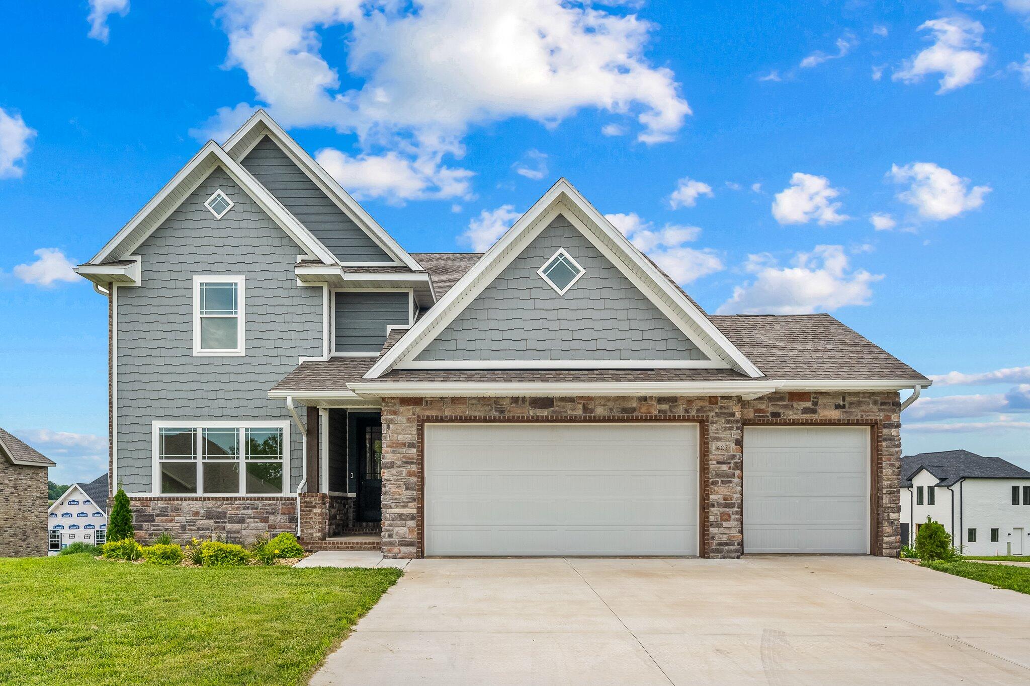 This beautiful home in Irish Hills Estates has everything you need for your family! This home offers 5 Full bedrooms, 4 Full bathrooms, and 3 living spaces! The kitchen provides white quartz countertops, a butlers pantry, white cabinets, an amazing ladder that reaches more cabinet space, a eat in kitchen, and an open concept into the living room. The living room provides ample natural light and floor to ceiling fireplace. The main level primary bedroom is spacious with a shiplap wall and the primary en suite bathroom has a walk in tiled shower, double vanity, and a HUGE closet with ample room! The laundry room comes right off the mud room and it can be accessed from the primary closet as well. The upstairs provides 3 full bedrooms and a bathroom. The basement has a full kitchen with a full bedroom and a full bathroom. Subdivision Pool! Dog Park! Award winning schools! Come see this one before its gone!