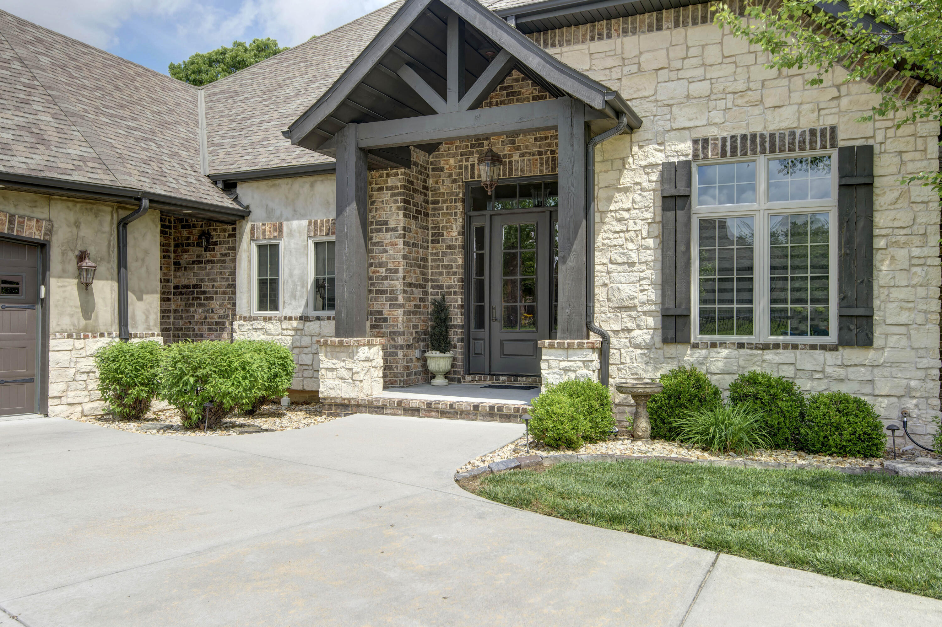 Fantastic find backing onto Fremont Hills golf course. Custom Quality Built in 2018 by Thomas McPhail with 11-foot ceilings, open floor plan, floor to ceiling windows, crown molding, barn doors, Kitchen with desk, huge pantry, charging station drawers stainless steel appliances including gas stove top, and wall oven. Spacious Granite island with space for bar stools Open to Great room with stone gas fireplace  beamed ceiling  Impressive entry lighting and Transom window. Laundry room and half bath with extensive cabinets and great office or hobby room. Master suite complete with gas stone fireplace, soaking tub doorless walk in shower, 2 large walk in closets one with direct access to laundry room. Two additional bedrooms and a full bath on east side of the home. Fourth bedroom Upstairs with a private bath and attic access with tons of storage space. Extras throughout, triple lock security doors, wash station in garage and F5 Storm Shelter in 3 car garage. Back patio with screened porch with floor tiles, firepit with natural gas. All backing to the golf course.  Must See to thoroughly appreciate the upgrades.