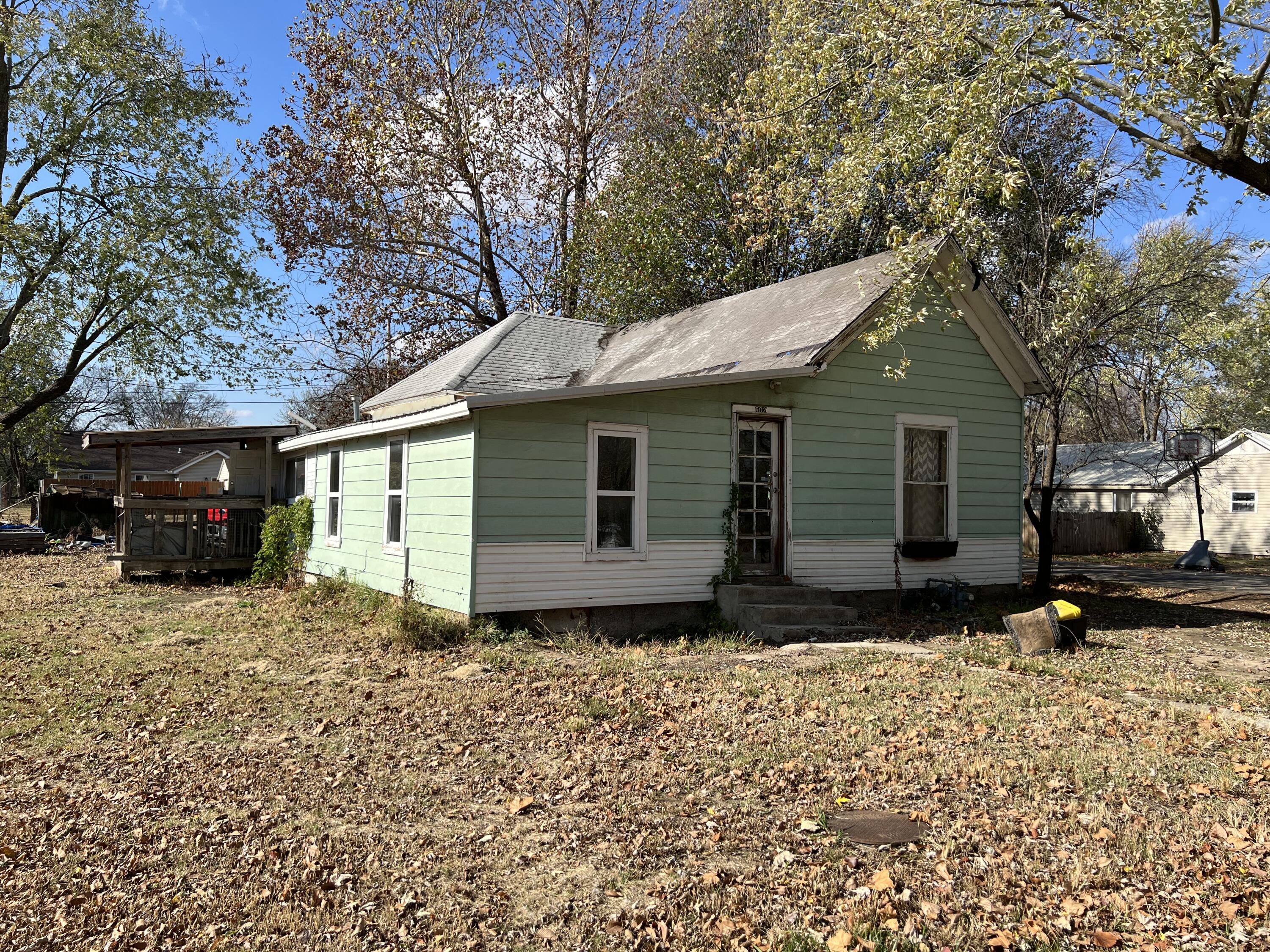 Investor special! Sitting on 3 lots. Remodel the existing house and build 2 more or tear down the existing house and build 4 houses. Lots of options on this property.