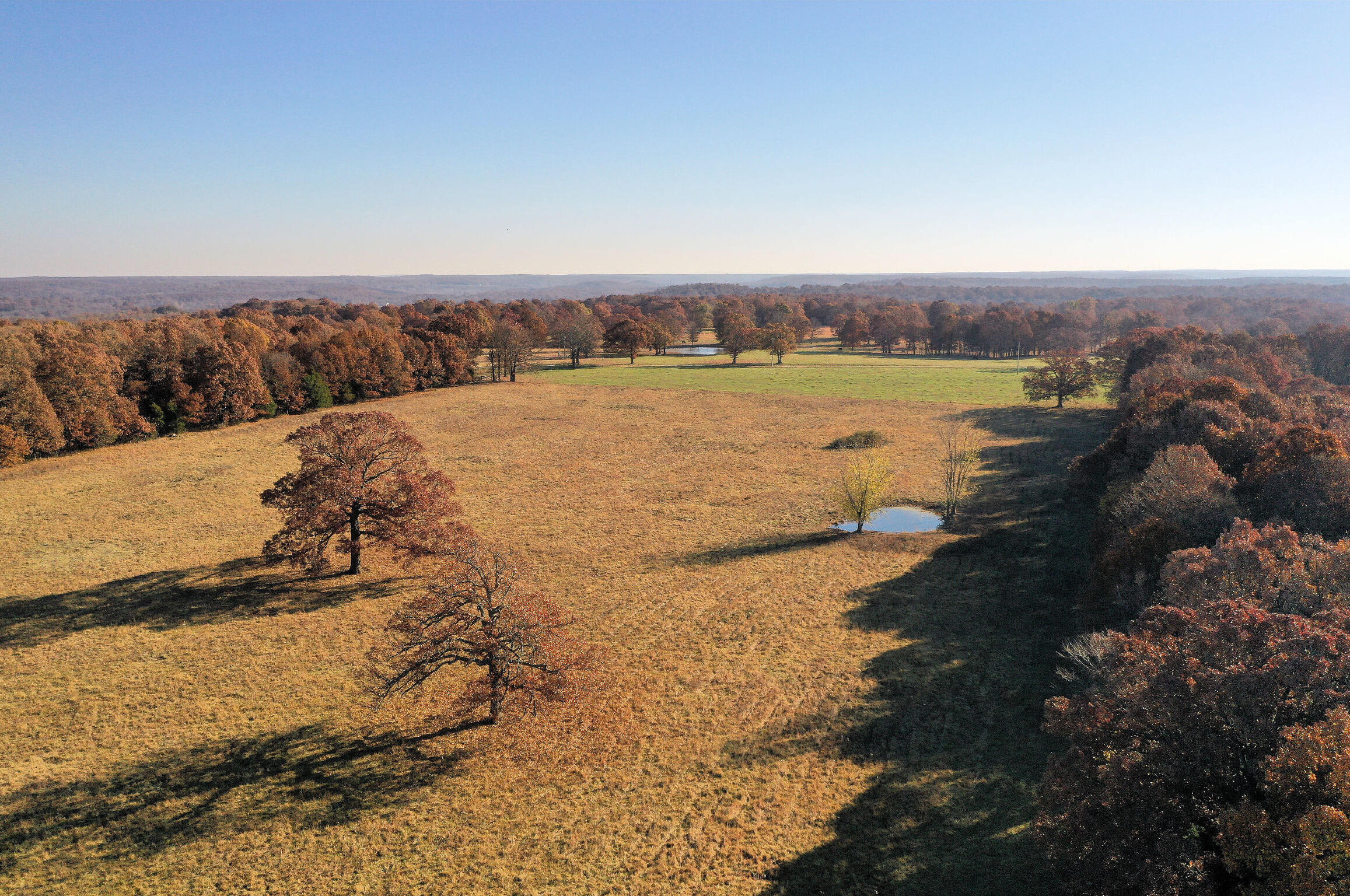 ACREAGE! Now available is this prime 5.15+/- acre build tract just minutes North of Springfield. This property features great access off of an asphalt/maintained road and has extremely easy access to MO-HWY 13. The tract has a very flat topography and is adjacent to neighboring larger tracts giving it a very private feel for a residential home site. Some of its great improvements include an existing cinder block BUILDING with power and garage-style doors. Would make an ideal small-scale and land investment in its present market with self-storage becoming more and more prevalent in the area as well.