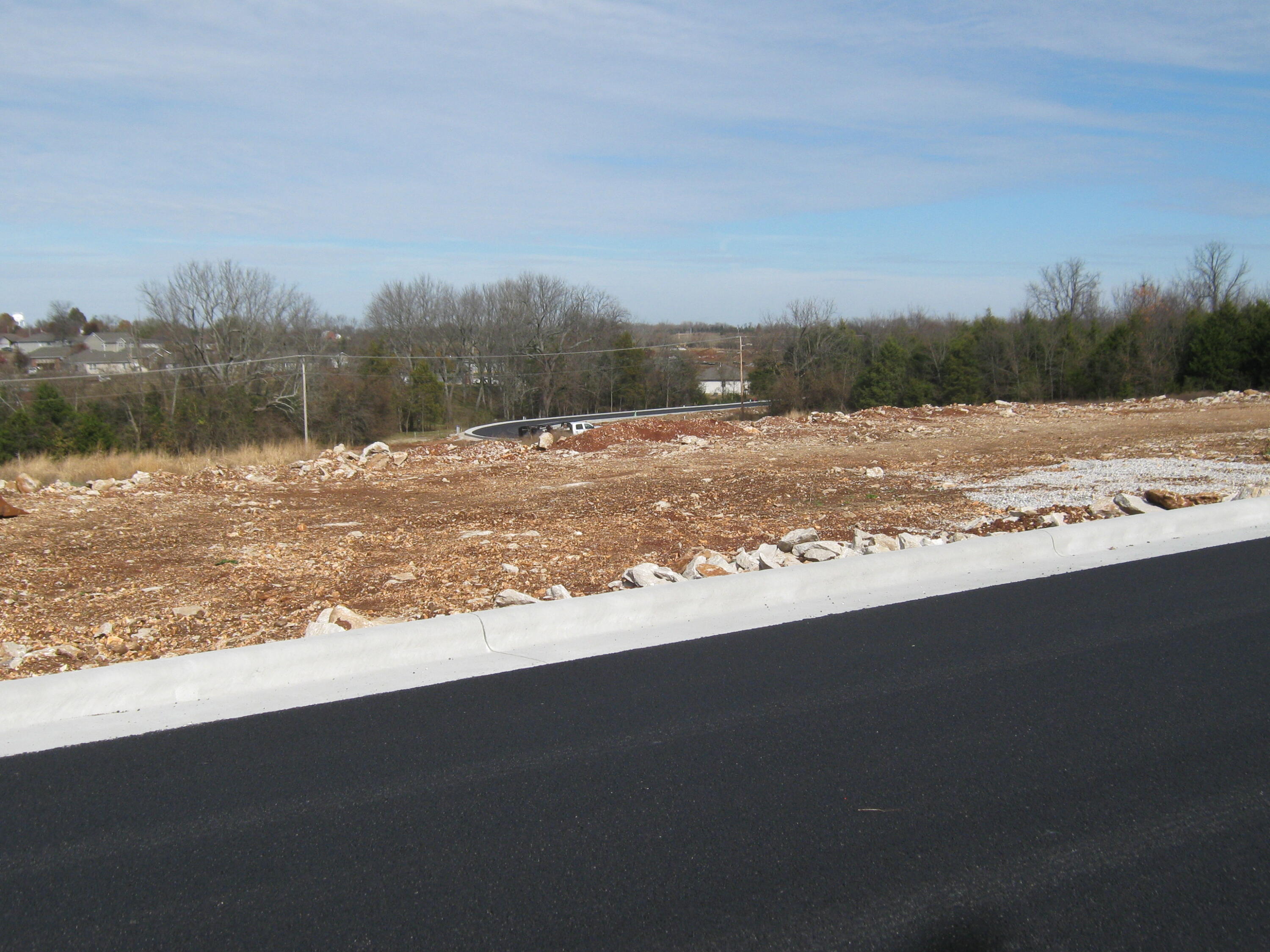 Walkout basement lot in a nice new, 42 lot sub in Willard. City water and sewer and natural gas are present.