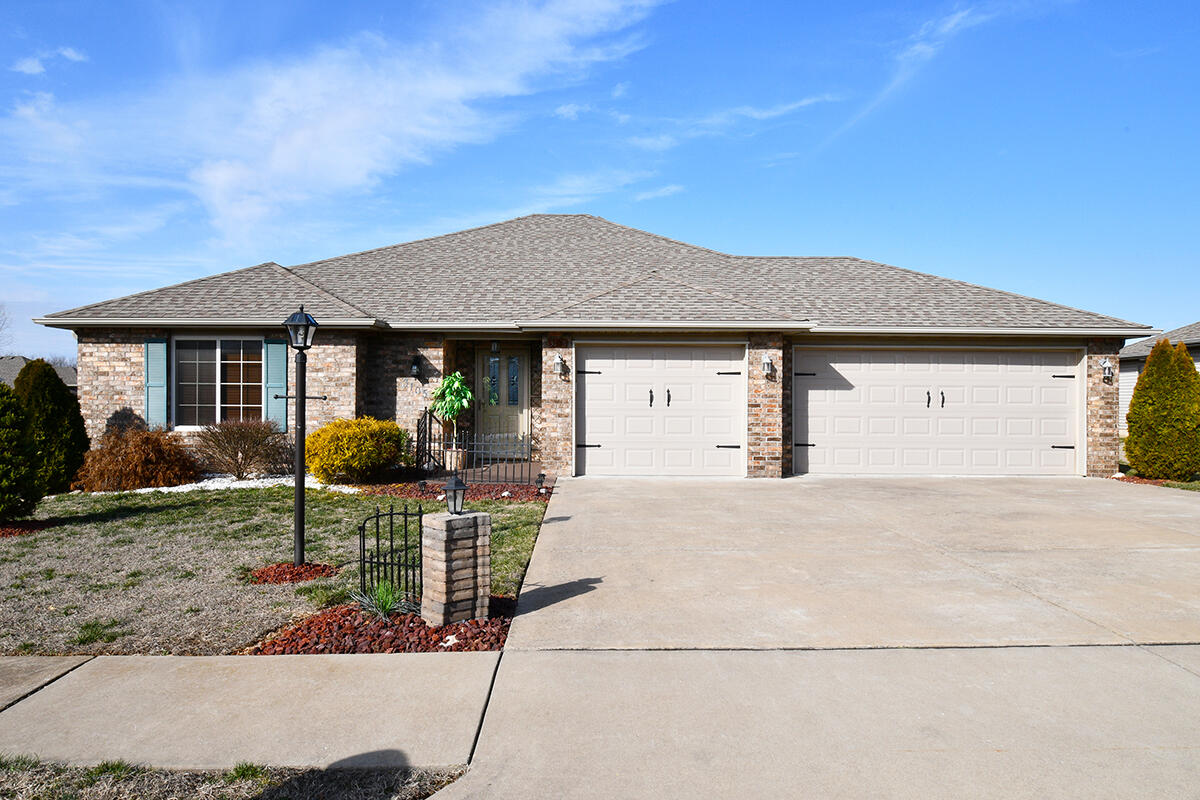 Very nice Move-in Ready home has 3 bedrooms, 2 full baths & a huge 3 car garage. Lovely Engineered hardwood floors, nice kitchen with granite countertops & includes all appliances. Electric fireplace provides delightful ambiance when dining at home.  You'll love Relaxing on your covered Back porch overlooking your big privacy fenced backyard with a drive through gate. Nice corner lot located in the desirable Spring Meadows subdivision. This 1 owner property has been exceptionally well maintained. Flat screen TVs in Living room & Master bedroom stay with the home too! Put this one at the top of your list!