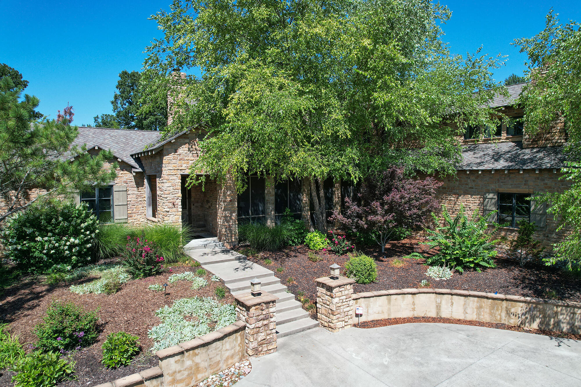 Welcome to your personal Yellowstone-inspired sanctuary, nestled in the heart of east side Springfield. This stunning 4-bedroom, 4-bathroom retreat seamlessly blends rustic charm with modern luxury, providing an escape that transports you to the tranquil beauty of the great outdoors. As you step inside, you'll be greeted by the inviting warmth of reclaimed wood accents and stone embellishments that mirror the natural textures of Yellowstone's landscapes.The spacious living area, adorned with vaulted ceilings and flooded with natural light, beckons you to relax in front of the crackling fireplace--a perfect fusion of rustic coziness and contemporary style.Prepare to be amazed as you discover the bespoke wine cellar, a haven for wine enthusiasts. This meticulously crafted space showcases your finest vintages in a setting reminiscent of the rugged caves of the region, offering an immersive experience unlike any other.