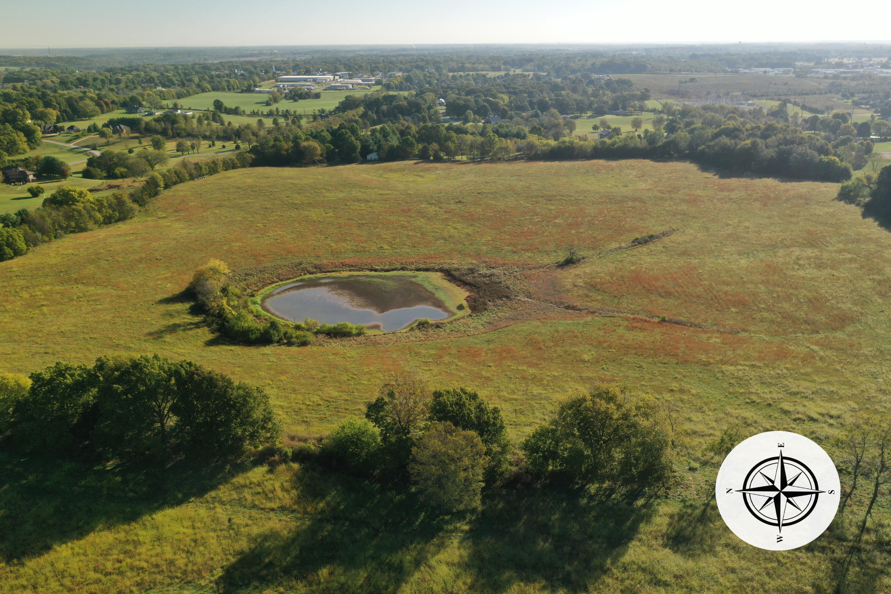 Rarely found 100 acres of grassland with an amazing location just off Nicholas road just north of Inman Elementary school and Tracker road in Nixa.  Featuring over 1300 feet of road frontage, this parcel of land has endless opportunities for developer wanting to subdivide into parcels for building hobby farms or even the individual looking for setting up their own farm with plans to build their forever home with lots of elbow room.  This property does have a huge pond and is gently rolling with trees on the perimeter.  There have been hundreds of trees planted along the west and north boundary of the property making it even more private in a few years.  This tract is one of the largest and most conveniently located parcels currently available on the market.  There are existing subdivisions to the south and east and acreage homes to the north.  More information is available upon request.