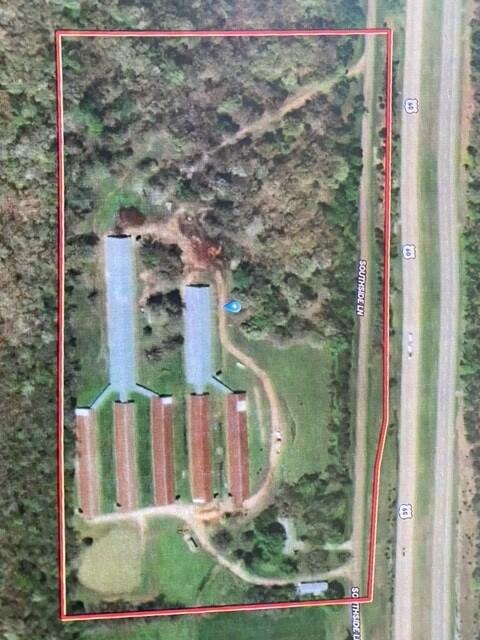 Brick Home in Wright County Missouri, 3 Bedrooms, 1 Bath, Laundry, Eat in Kitchen, Living Room, Family Room, Attached GarageCommercial Poultry Operation7 Houses with 121,000 capacityShop2950 South Side Lane, Mansfield in Wright County, Missouri  this farm is a unique and exciting property that offers a turn-key opportunity to own and operate a commercial poultry farm. with Multiple Poultry Houses 5-40 X 250 Feet, 1- 50 X 360, 1-50 X 230 with covered runs for changing houses with age/size. The farm has the capacity to house up to 121,000 chicks to grow for layers featuring state-of-the-art equipment that is designed for the comfort, safety, and productivity/growth of the birds.  Chicks are placed as day old then moved to layer facilities nearby at 17 to 20 weeks depending on which breed of birds are being raised.The farm house on the property is a brick Ranch style, well-appointed home with three bedrooms and one bathroom, making it an ideal space for farm owners, farmhands, or guests. The open-plan living area features comfortable family room with a cozy fireplace, providing a comfortable space for relaxing after a long day on the farm plus a nice deck on the back for you family barbecue's.The kitchen is fully equipped with modern appliances, custom cabinetry, country eat in Kitchen plus dining room making it a perfect space for meal preparation and cooking. The adjacent dining area is perfect for hosting intimate dinners or large gatherings.The property also includes an attached garage and a large shop/barn that can be used for storage or as additional workspace. The spacious driveway provides ample parking for vehicles and farm equipment.