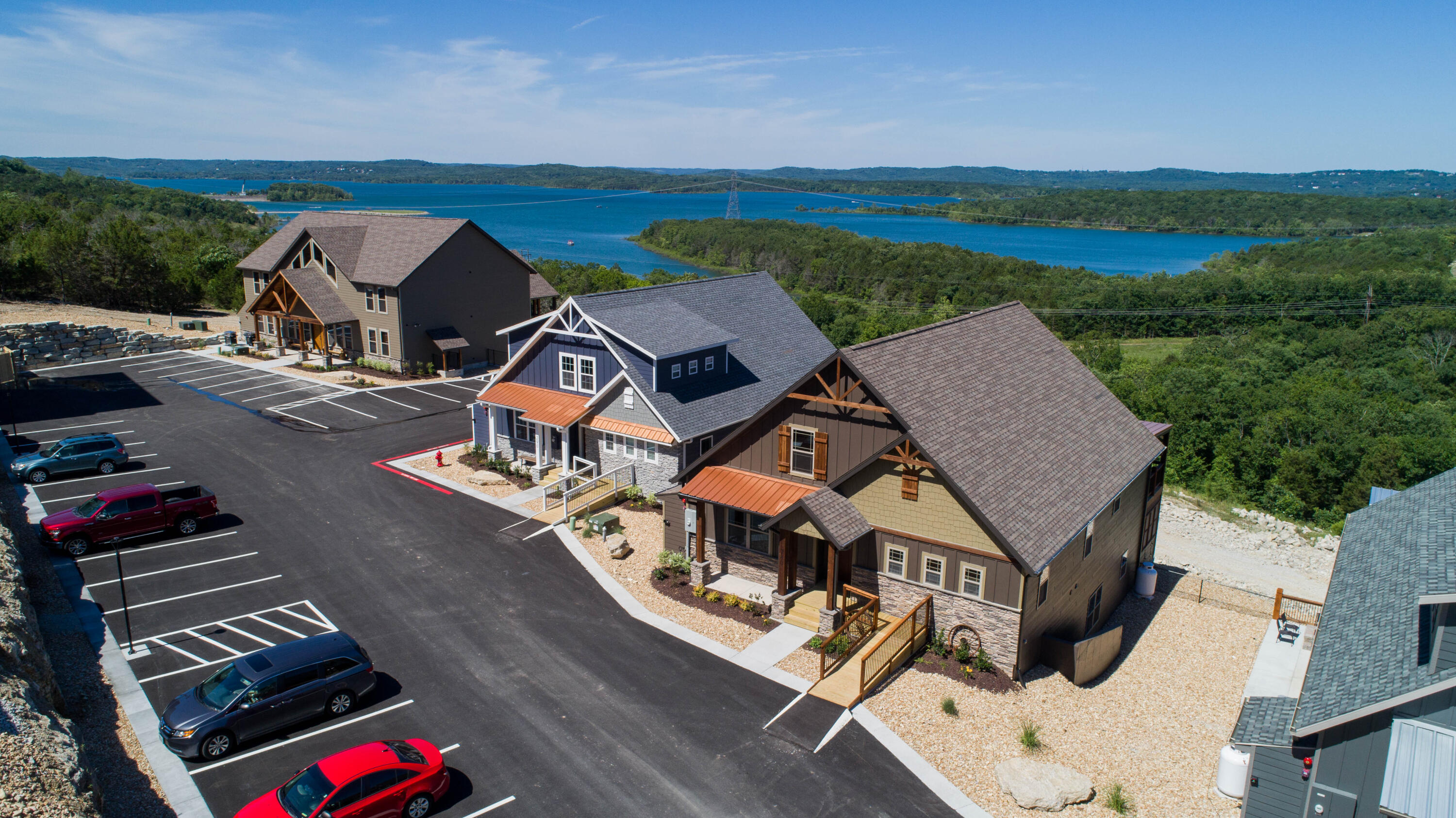 Luxury, Space, and Upgrades Galore! This is a turnkey 9 bed 9 bath vacation rental with the million dollar lake view. This property has 4 years of successful bookings (owner managed). This is a beautiful house to behold, with tall ceilings, walk-in ramp, top notch furnishings and tvs, and lots of extras. Christmas tree and decor, extra kitchen items including two crockpots and two griddles, extra dishes. The house also includes essentials for families, such as pack n play, booster seats, two gas grills with extra propane tanks, lockboxes with extra keys, two washers and dryers, two refrigerators, two dishwashers, etc. In addition, it sleeps 24! This has been a mostly hands-off property for the owners because of the systems they set up for the guests. This development has designated parking spaces for each unit plus extra spots! There is an indoor and an outdoor pool area and playground for the littles. And don't forget about the lake view. In fact, you can literally walk to the lake on the lake trail which is just below this house. Owner is Listing Agent.
