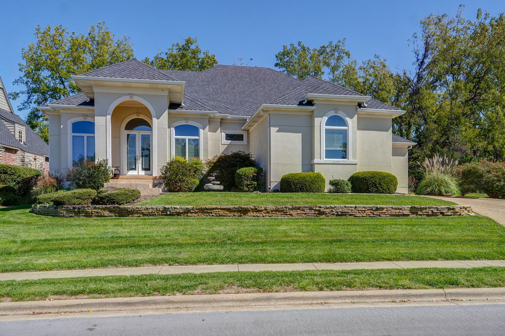 Elegant custom home with a magnificent golf course view of the Millwood golf course.  This stunning 1 1/2 story home with a light and bright interior features approximately 3,572 finished square feet living space with 3 bedroom, 2.5 baths, an office, formal living & dining, a large kitchen & hearth room plus an unfinished basement for storage.  You will love the floor to ceiling windows throughout the main living areas of the home, the high ceilings and the quality finishes.  For outdoor enjoyment there is a large, covered patio and a second open patio off the luxurious master suite.  This home is a timeless treasure!