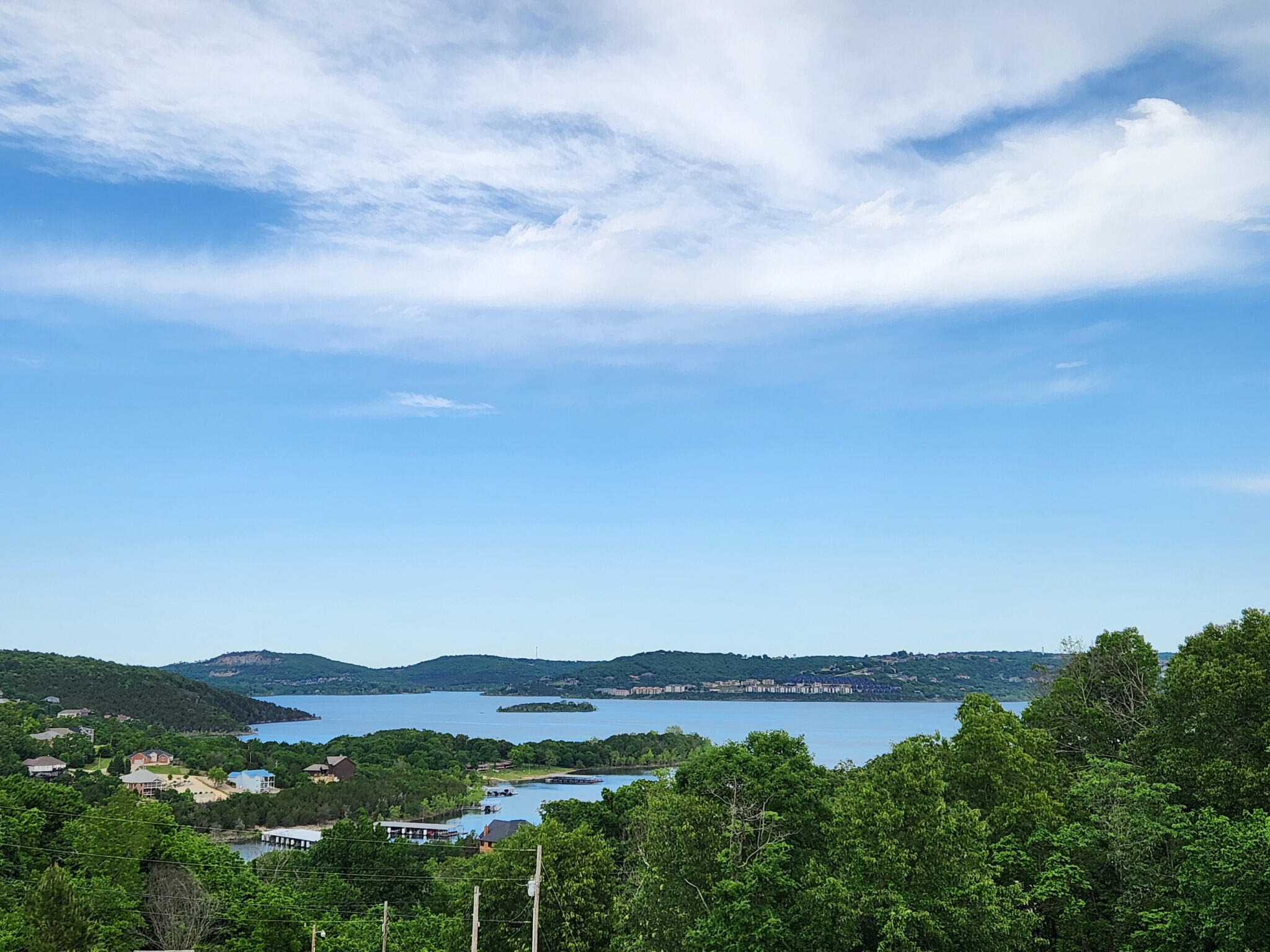 Lakeview acreage! Beautiful 180 degree view of Table Rock Lake. Boat ramp and docks directly down the street. Almost 4 acres to dream on. Private oasis, multi-use property, business, villas, development, etc..... Right off Hwy 86. Private entrance to property off Moore Lane. Well-established landscape berm provides sight and sound buffering. Treatment plant in place that can handle 4,200gal continuous. Community water with meter in place. Electric on edge of property. Come see how you can make the lake your backyard. 15mins to town. Big Cedar, Top of the Rock, Marina just minutes away. Bring your plans. Hard to find water view with acreage.