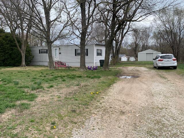 Great investment opportunity for a 3 bedroom, 2 bath double wide on a huge lot located across the street from the Mt. Vernon Elementary school.  The lot is very level and includes a large metal shed in the back as well.  The structure has approx. 1200 square feet and has a large front living area, dining room, and a great kitchen with plenty of cabinet and countertop space.  There is a full guest bath and a jack & jill bath between two of the three bedrooms.  The lot is .65 acre and is very open and level.  Easy access to Mt. Vernon Blvd and within a couple of minutes of I-44.