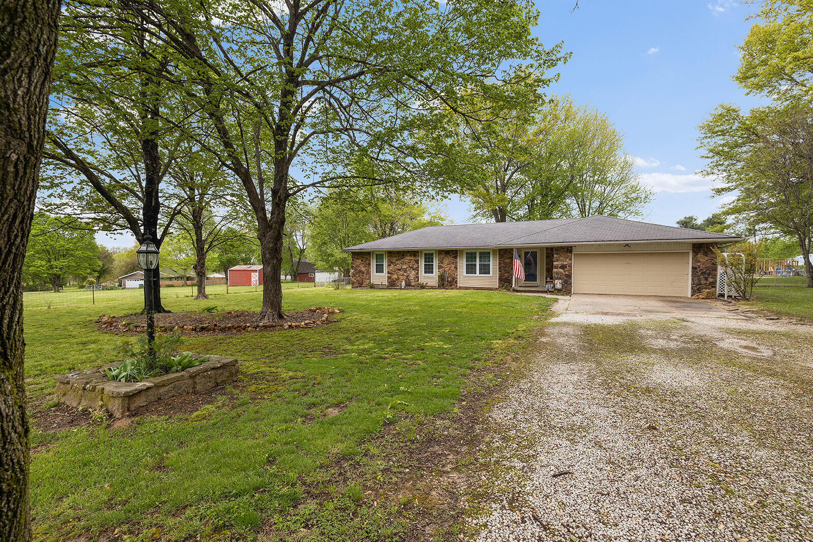 SMALL ACREAGE HOME in OZARK with a gorgeous in-ground Pool for under $250,000!  This ranch home in one of Ozark's long established neighborhoods features 3 Bedrooms including a Master Suite with walk-in shower and 2 closets, Sunroom, 2 Living Areas, Floor to ceiling stone fireplace, and an AWESOME 1.6 Acre Lot with a very private, fenced back yard overlooking pasture behind them.  This home is in the heart of Ozark just off CC/65 area and just minutes to all major shopping, dining, and school activities.  Incredibly convenient and ready for you to put your personal touches on!
