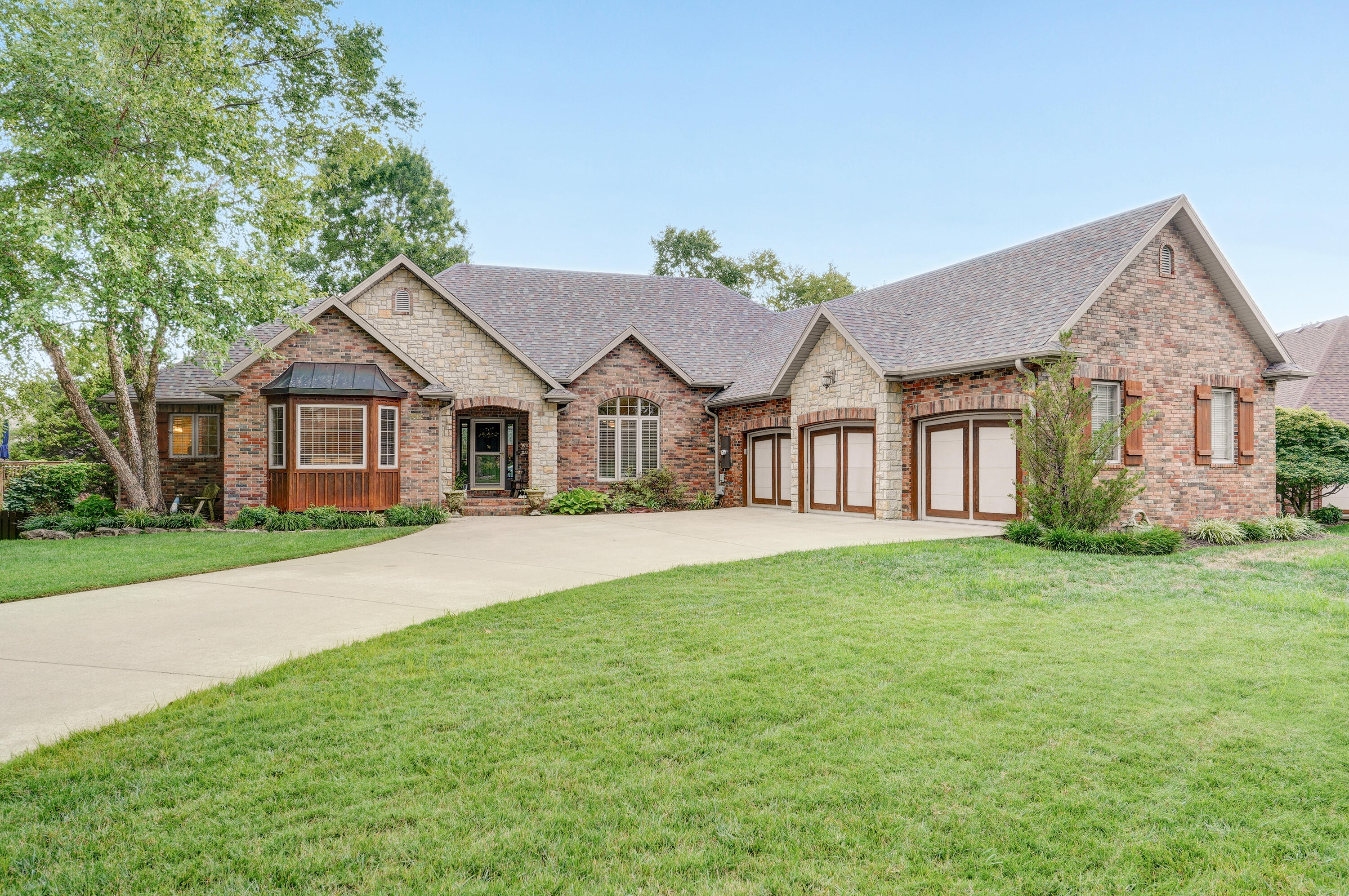 3070 W Cedarbluff Dr is a beautiful one owner home in the Rivercut subdivision. The curb appeal features a lovely front porch and a large flat driveway with 3 individual garage bays. Walk inside to find tons of natural light, hardwood floors and a perfect floor plan for entertaining friends and family. The formal living and dining room lead into the hearth room and gorgeous kitchen where you will find a center island, food pantry and a butler pantry/bar area. You can enjoy your coffee or grill dinner on the spacious deck just off the kitchen. The sizable laundry room, half bath, master bedroom/bath and a second bedroom/office are also on the main floor.  Downstairs you will find three additional bedrooms, two full baths, family room, wet bar, recreation area and more! Don't miss the storm shelter/wine cellar and the John Deere room offering a pet door leading to its own fenced area.  The large fenced backyard is flat, making it an excellent place for parties, gardening and all types of outdoor activities! Don't miss this amazing home located on a wonderful family-friendly street!