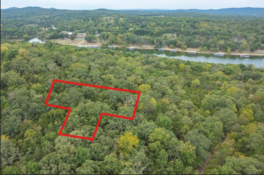 Almost an acre of land located on a mountain top in a private setting with no restrictions. Only a short walk to the sparkling waters of Table Rock Lake.