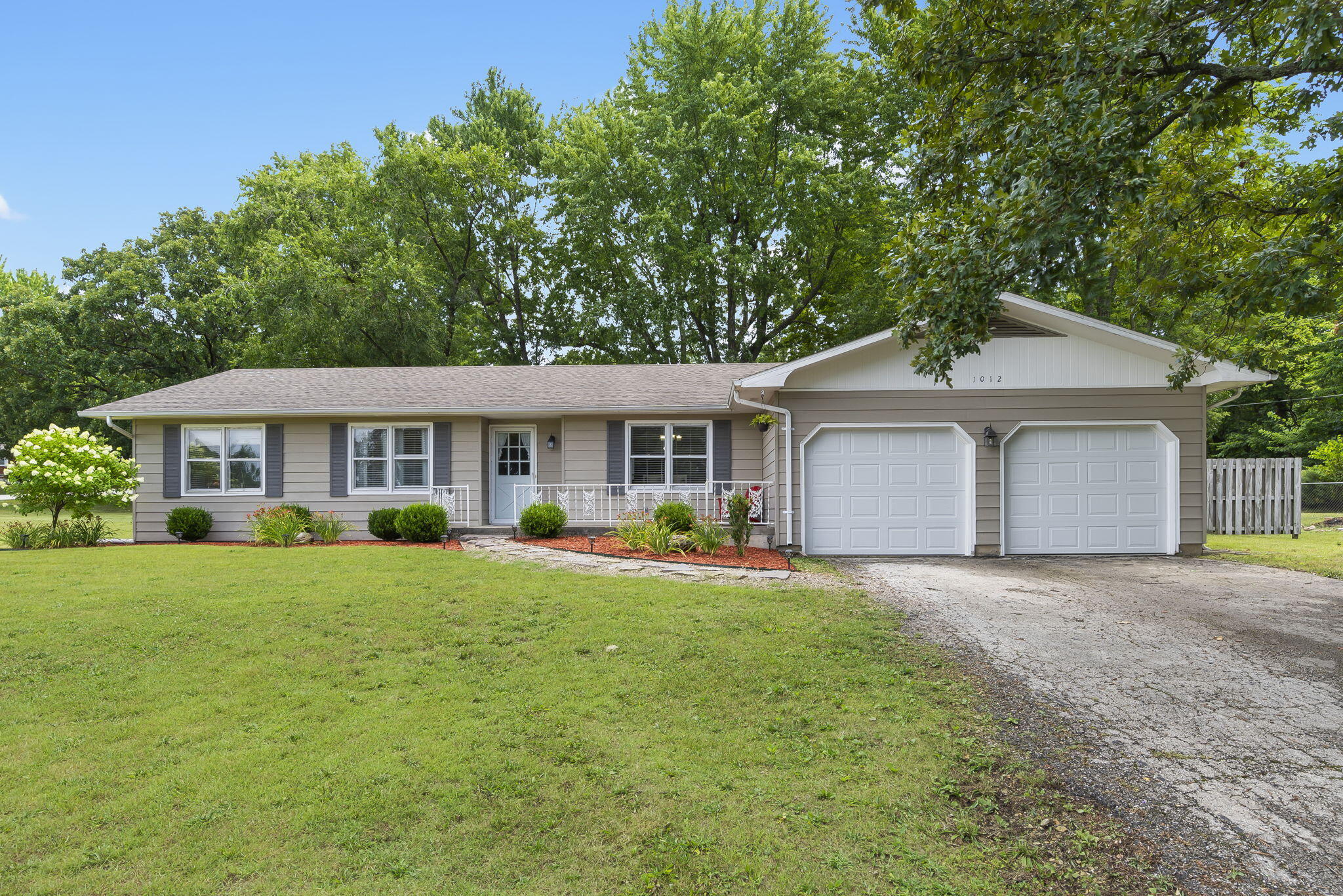 Don't miss this amazing home on just over half an acre right in the heart of Marshfield. You will love the wide open feel of this 3 bedroom 2 bath open concept home. Wood burning fireplace and hardwood floors in the living room, and a great finished sunroom with new flooring, newer paint and new furnace,  It has new insulated garage doors, new insulation in the attic and crawlspace for energy efficiency, and new exhaust fans in the bathrooms. Located on a large corner lot, is has a nice back patio and a storage shed.  With school starting soon, this home won't last long!  Schedule your showing TODAY!
