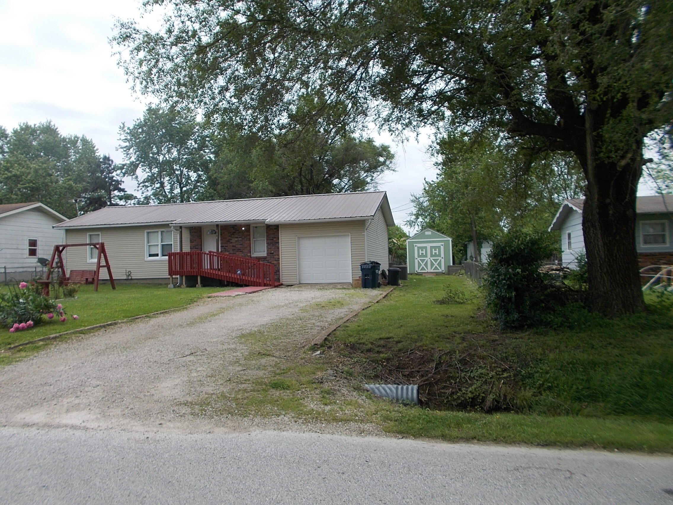 This very nice home has 3 bedrooms and 1 bath. It rests on a quiet street a rocks throw from the walking trail that leads to the park. It is complemented by a chain link fenced back yard. This is a really nice home, call for a showing it won't last long.