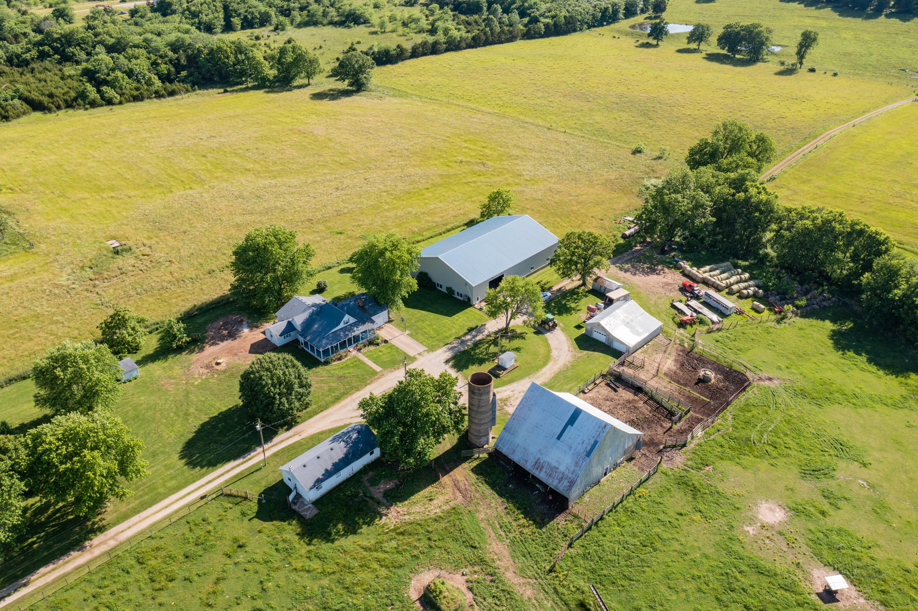 Welcome to 8394 East Wommack Lane. This is a century farm that has been within this family for over 150 years. This 210 acre property is currently set up as a turn key cattle operation with all fencing already in place along with 6 ponds located through out the property, 3 of which are spring fed. The fencing is set up for perfect cattle rotation around the property. This land has been impeccably cared for through out its lifetime with this family. Offering a hay barn, 66x100 machine shop, milk barn, and a small work shop, this property boasts plenty of space for any and all projects and necessary elements to running your cattle operation. With 75% of the land as pasture there is ample room for cattle to roam and graze, however plenty of trees and woods are located on the property for cattle to seek protection or to be utilized for hunting.  The home located on the property offers 3 bedrooms, 1 bathroom, updated kitchen, pellet stove, newer HVAC unit, and a garage. This property has an abundance of amenities that are perfectly in place for you to make this your dream property. When you see this property in person, you will not be disappointed by the comforting feeling of the home and the land. Set your appointment up today to view this rare chance at owning 210 acres of prime cattle and farm land in the heart of the Ozarks.
