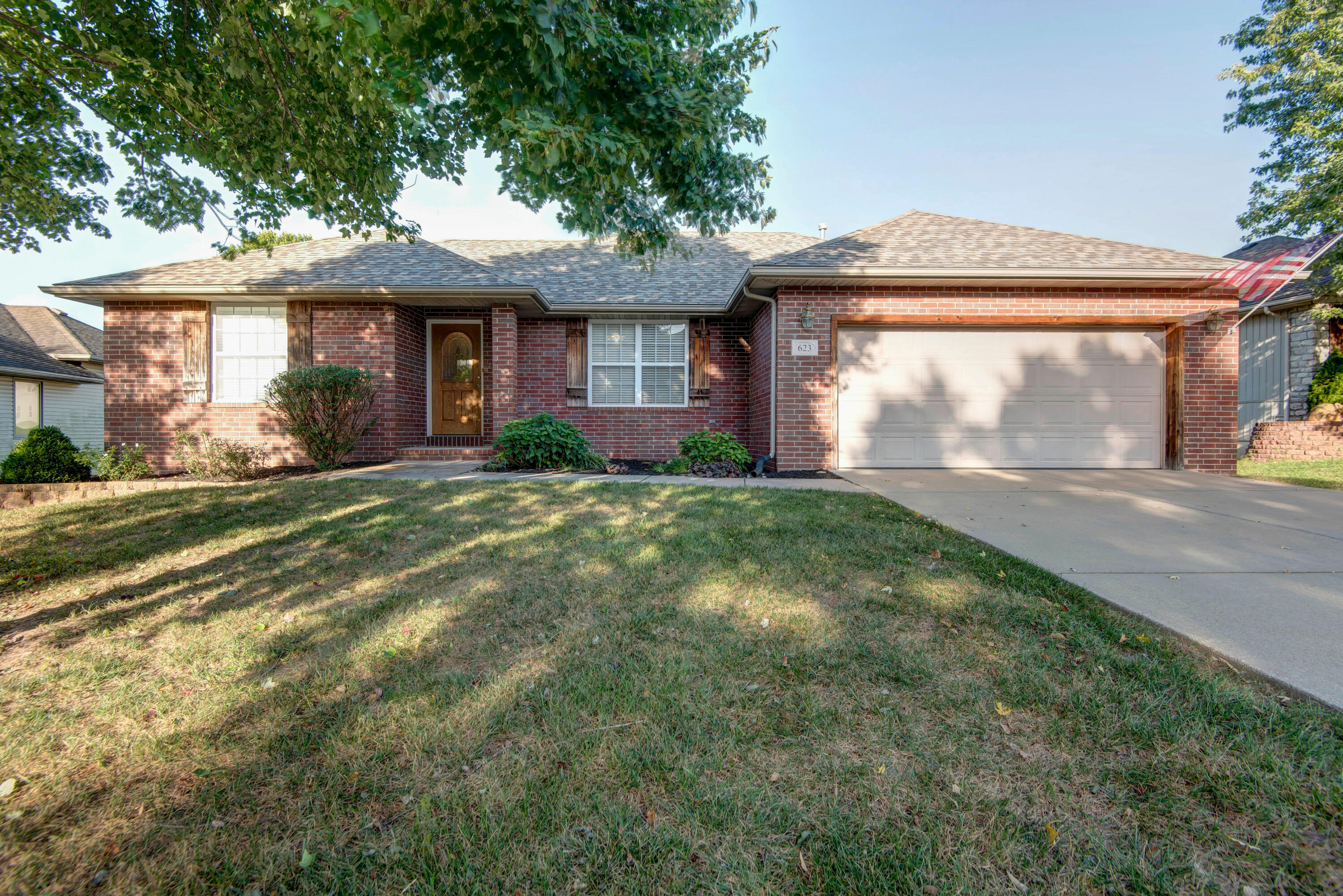 Charming brick and vinyl siding home in Nixa with numerous updates.  The roof is just 2 months old and the basement features new luxury vinyl plank flooring. The A/C, furnace and hot water heater have all been replaced in the last 8 years.  The deck is only 1.5 years old and has been freshly re-stained.  Enjoy the warmth of the gas fireplace in the living room, and tile flooring in all bathrooms.  Master bathroom has seperate tub and shower with dual vanities.  The home also boasts ceiling fans throughout, a second living area, ample storage, and a John Deere room in the basement.