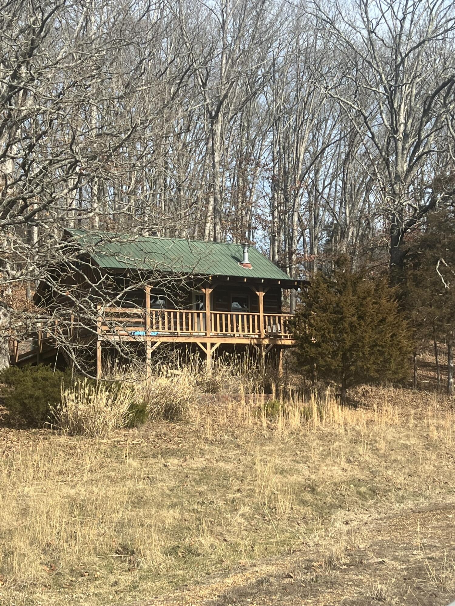 Cabin on the River, Yes Please!  Get ready for Summer!  on your own waterfront property.  Own both sides of Dry Fork Creek on this 19.3 acres of property!  Complete with picnic area and private location.  Stream is a tributary of the Merrimac River.  When there is frost on the ground look for the teepee rings and fire rings impressions left from when the Indians called this area home.  Arrowheads and artifacts are plenty Beautiful home with 3 bedrooms upstairs and two downstairs, (one is non-conforming, no window) Full finished basement, large deck off the great room provides breathtaking views of the farm land spread out in front of you.  Watch the trophy bucks and does as they visit the stream and enjoy the pasture land.  Turkeys too call this location home.There is a wood furnace with a few adjustments will help heat your home and lower your electric bill.  A Quonset hut for storage with concrete floor, 220 electric, and plumbed for water.  There is a livestock barn approx. 56x46 with a lean to for all your animals, a chicken house and a smaller stable in another paddockProperty is fenced and cross fenced too.But that's not all!.  There is a beautiful log cabin that you could use for guests, in-laws or make a little extra money by renting it out as an Airbnb.  Complete with indoor plumbing, electric heat, and amazing antique cook stove.Home is very private, but only 10 minuets from St. James.   St James is also home to many of Missouri's Vineyards, and floating rivers!  Call to see this amazing property today!