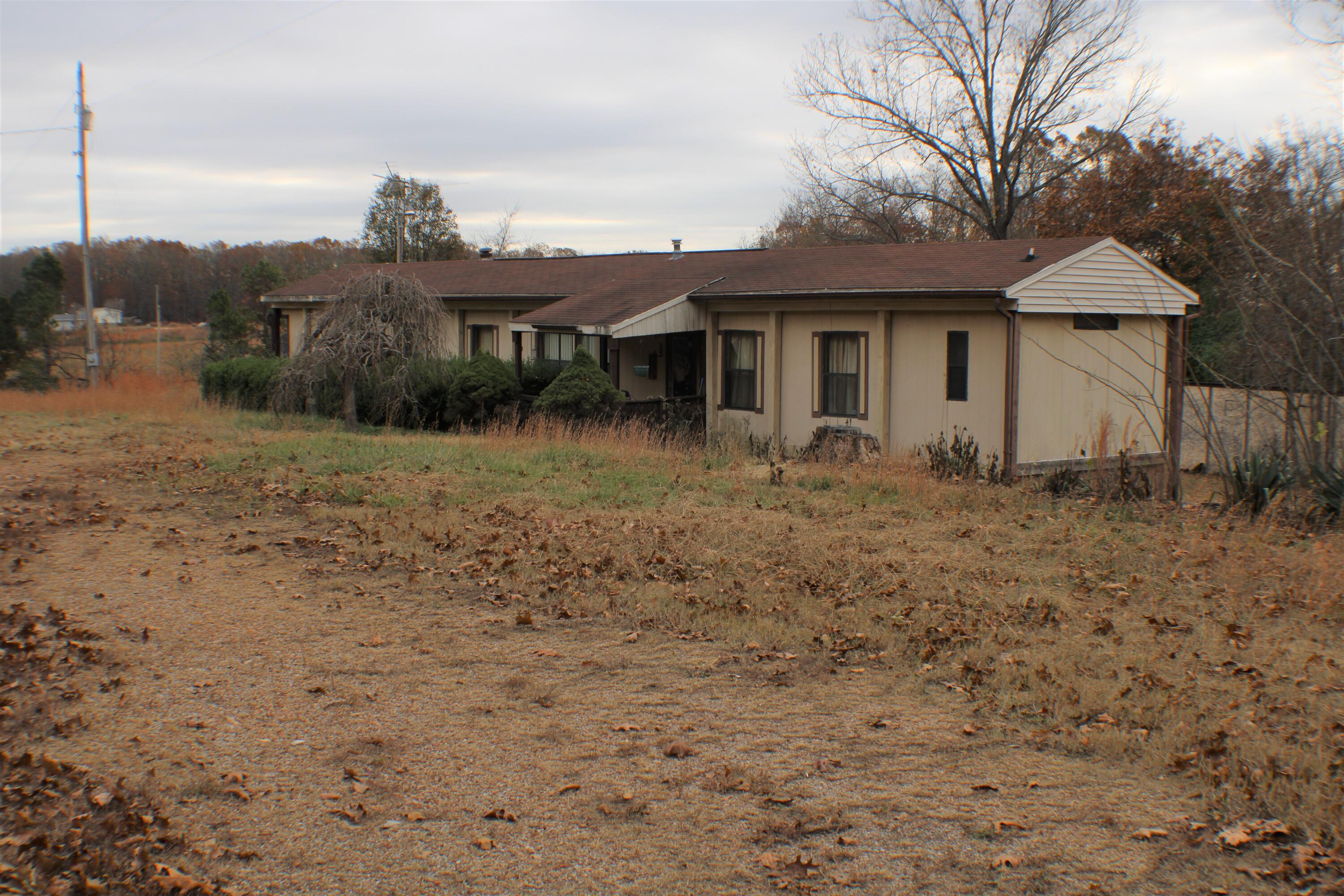 This home sits on two acres outside Caulfield and across the road from Cloud 9 Ranch. It is an excellent property with no restrictions, a well, and a septic tank. The property includes:A storm shelter.A detached carport.A well house with electricity and a concrete floor.The mobile home has two bedrooms and two full bathrooms; also, a self-supported mobile home roof protects the home and extends the life of the roof and the house itself. You will love the location. Located close to all the amenities- Top Rated Hospital that offers Major and Specialized Medicine, New and Established Businesses offering many things not typically found in small towns, Missouri State University, plus all the great dining options. This property is close to the new Bull Shoals and Norfork Lakes or several great rivers like the North Fork of the White River, the Little Piney, Jack's Fork, and the Eleven Point. And remember Mark Twain National Forest, Taum Sauk, and Grand Gulf Parks, to name a few. There are also many spectacular natural Springs and historic Mills throughout Southern Missouri to visit with the family.