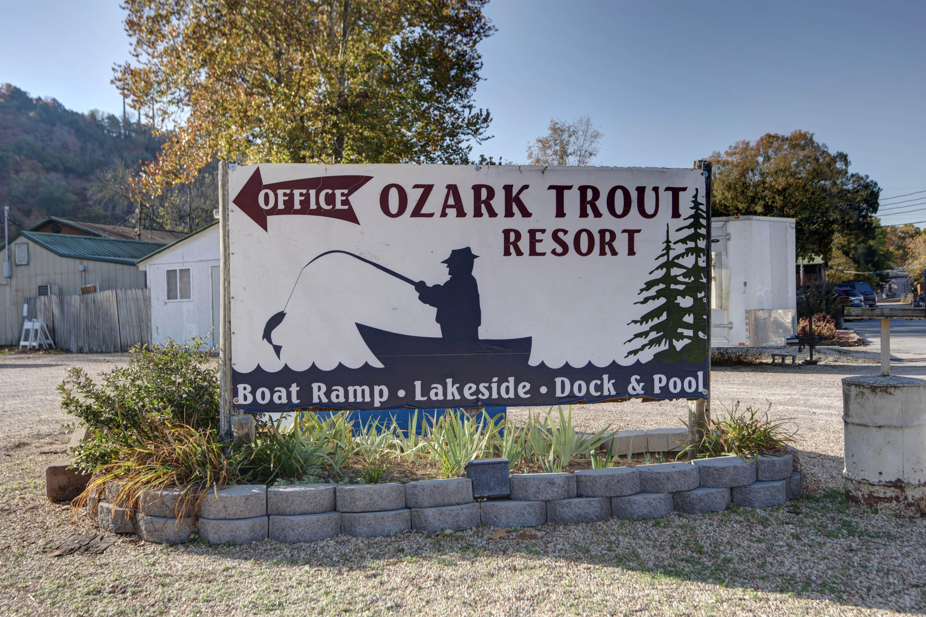 Follow Your Dream Of Owning This Divinely Peaceful 12-Unit Resort along the finest Trout Fishing Lake in the area! Located just a few short minutes to Branson's 76 Country Blvd, but tucked away for the clientele who love the ozark's tranquil beauty along Lake Taneycomo. Well established repeat business with room to grow. The 12th unit is currently being renovated for either rental or living quarters. There's easy access to Cooper Creek Boat Launch, but if needed, this resort has one of the few boat launches on site. The 10-Stall onsite boat dock with updated composite decking includes a large open deck area for fishing or deck chair relaxing. Other features include onsite office & laundry area. Well maintained resort with many updates. Best smaller lake front resort available! Check out the website. https://ozarktroutresort.com/