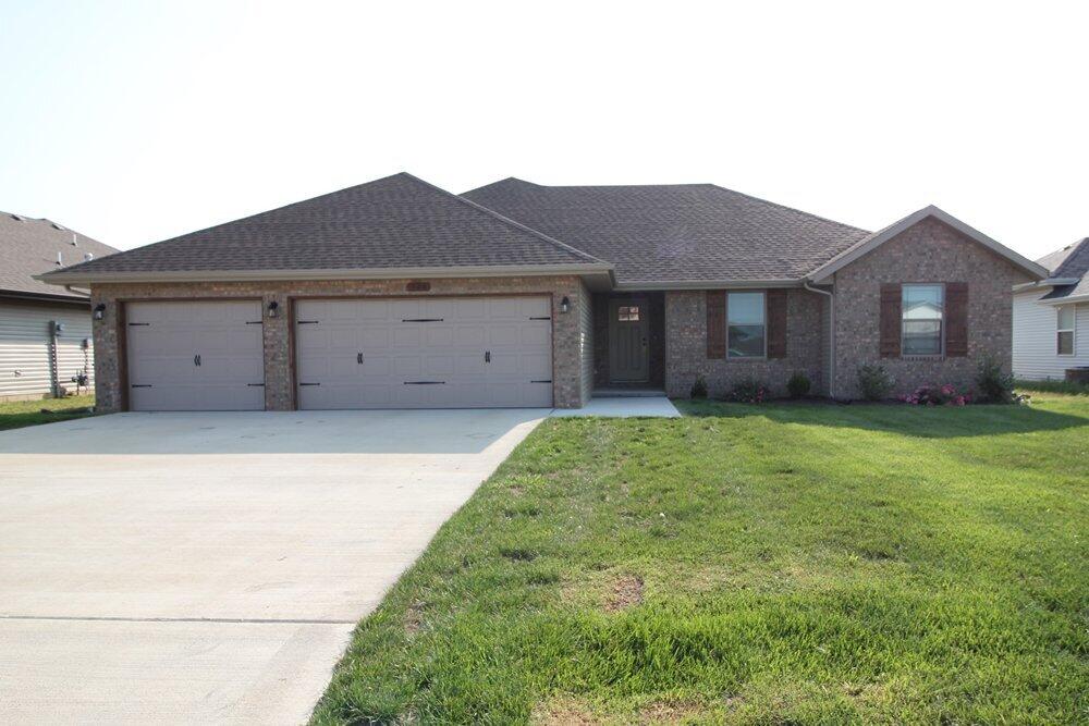 Amazing home located in Woodland Hills Subdivision in Rogersville. This home features a split 4 bedroom, 2 bath, open floor plan with a 3-car garage. Luxury vinyl plank flooring throughout the home. You will love the garage entry with a walk-in pantry with wood shelving, drop zone bench and large laundry room. Kitchen features custom wood cabinets with stainless appliances (including refrigerator), island seating & dining area. Large master suite has a great walk-in closet with custom wood shelving, dual-sink vanity and tile walk-in shower. Granite counter tops are found throughout the home! Maintenance-free exterior and covered back patio overlooking a fully-fenced private backyard. This home is ready for you to make it your own!