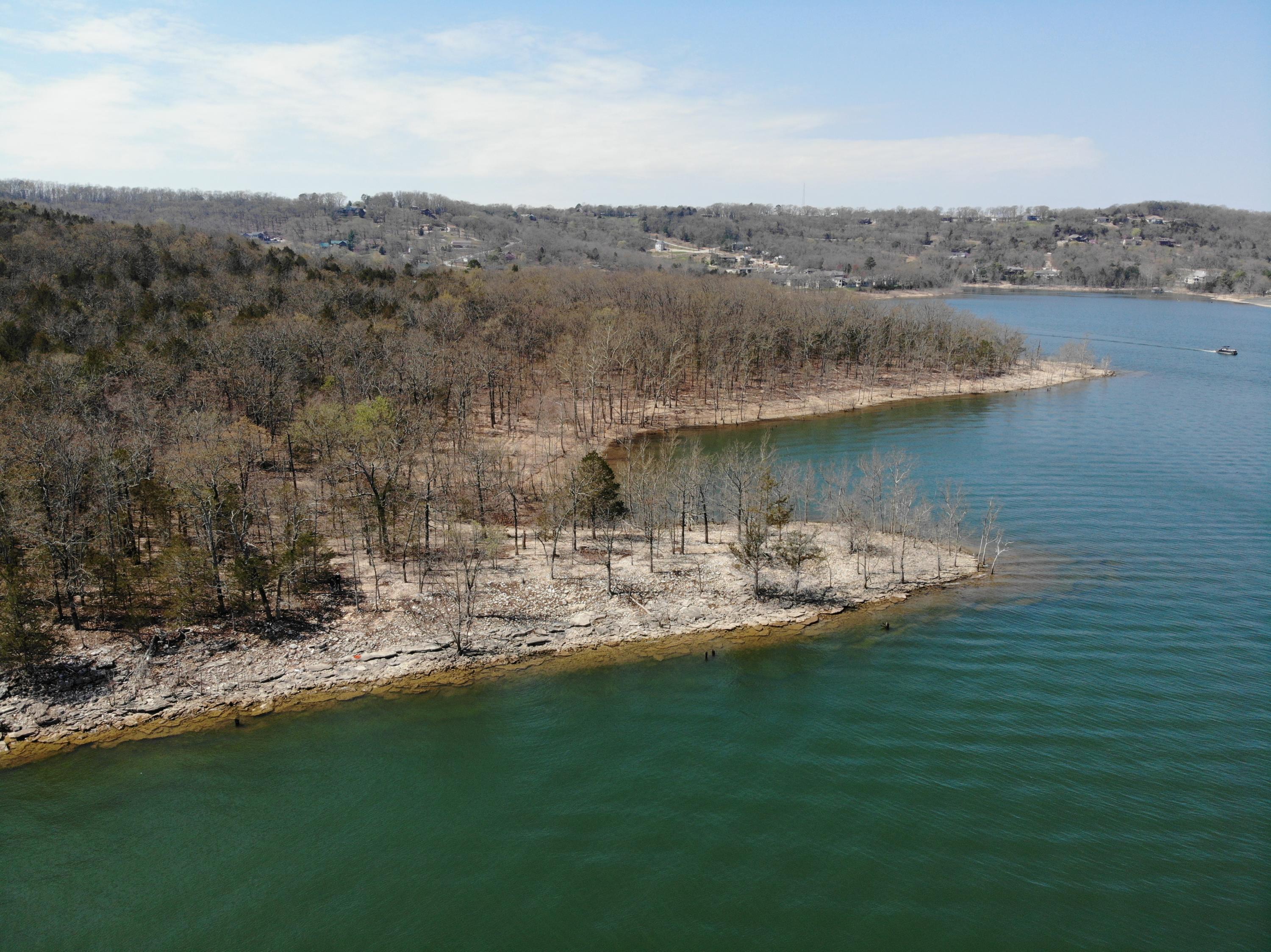 Welcome to the most AMAZING VIEWS of Table Rock Lake, PERIOD!! Looking for your very own 20+ acre Lakefront estate??? Scratch that... Want to OWN YOUR OWN LAKEFRONT MOUNTAIN???  Considerable development opportunity with over 2600 feet of Table Rock Lake Frontage. Did I mention it is CLOSE TO EVERYTHING???  EVERYONE gets a room a VIEW when you look at the topography of this land.  Engineers plans with 4 different development options have already been drawn up by the sellers & are available upon request. Located directly across the lake from Big Cedar Lodge with the most amazing PANORAMIC VIEWS! Whether looking for yourself, a few, or a development in mind, THIS IS IT!!  There are not many buildable sites in this area on Table Rock with this kind of potential!!! Did I mention there are no HOA's, Covenants or Restrictions?? Additional details provided upon request. Buyers to do own due diligence when verifying all measurements & amenities.