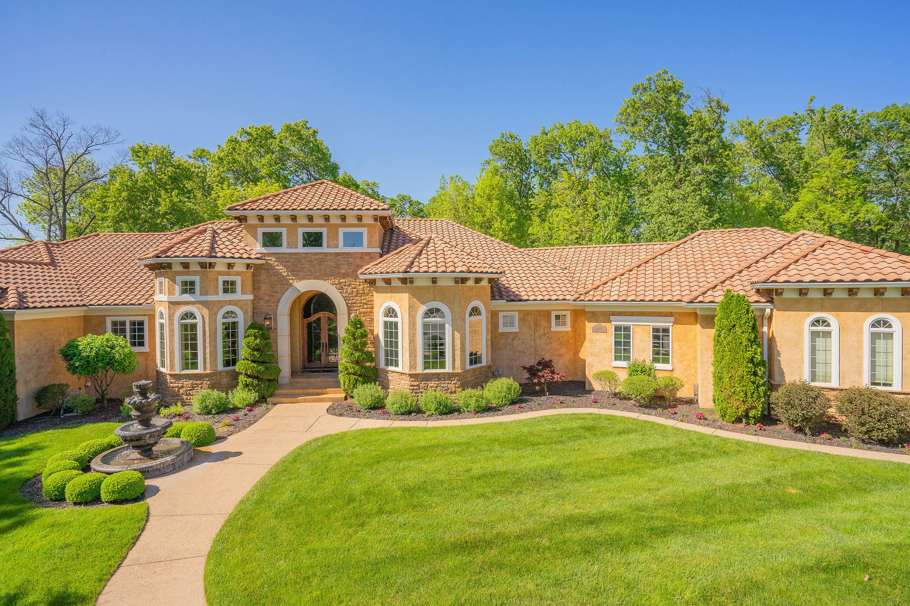 This extraordinary luxury home located in beautiful Fremont Hills will not disappoint! A quick drive down immaculately manicured streets will lead you to this stunning Mediterranean style home located at the end of a cul-de-sac on a large double lot.  Also included for your peace and privacy that adjoins the home, is 1.8 park like acres with a tranquil koi pond and additional garage for extra storage.  Upon entering, you'll find soaring elevated ceilings and opulent finishes down to the finest of details.  The impressive master en-suite, with its vast closet and mirrored dressing area, will become your sanctuary. 5 bedrooms and 4 & 1/2 bathrooms span the remainder of the home, all maintaining the stunning architectural design that flows throughout.  There is no shortage of ways to relax, whether it be cozying up in front of one of the two magnificent fireplaces or relishing in the serenity of the private hot tub and sauna.  Host lavish parties in your outdoor oasis with a tiled and granite outdoor kitchen with a professional Evo grill.  You'll enjoy maximum comforts to include 3 hi-efficiency zoned HVAC systems, a 100-gallon water heater, water softener, in-ground sprinkler system, and 1000-gallon buried propane tank.  Even your pets will live in luxury, with their very own spacious courtyard gated with stucco and ornamental iron fencing.  No detail has been missed in this remarkable one-owner home! Also available for sale is 6 acres +/- of additional land that adjoins the property.  If it makes your move easier, the furniture and decor in the home are available to purchase. Call now to arrange your private showing!