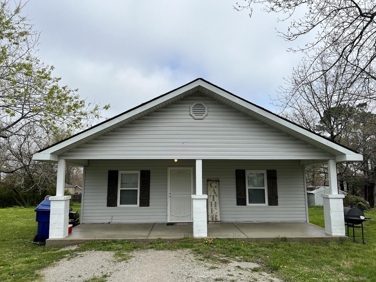 Welcome to Mansfield, Missouri where The Little House on the Prairie were written!Become part of this community with the quaint two bedroom, one bath home.  Located on a sizable lot in the city limits, the yard boasts several beautiful trees.The covered front porch spans the entire front of the home and welcomes you into the living room.  The kitchen is located just off of the living room and the laundry room is just beyond that with a door to the back yard.Whether this is a house for you or an investment, welcome home to the Ozarks of Southern Missouri.