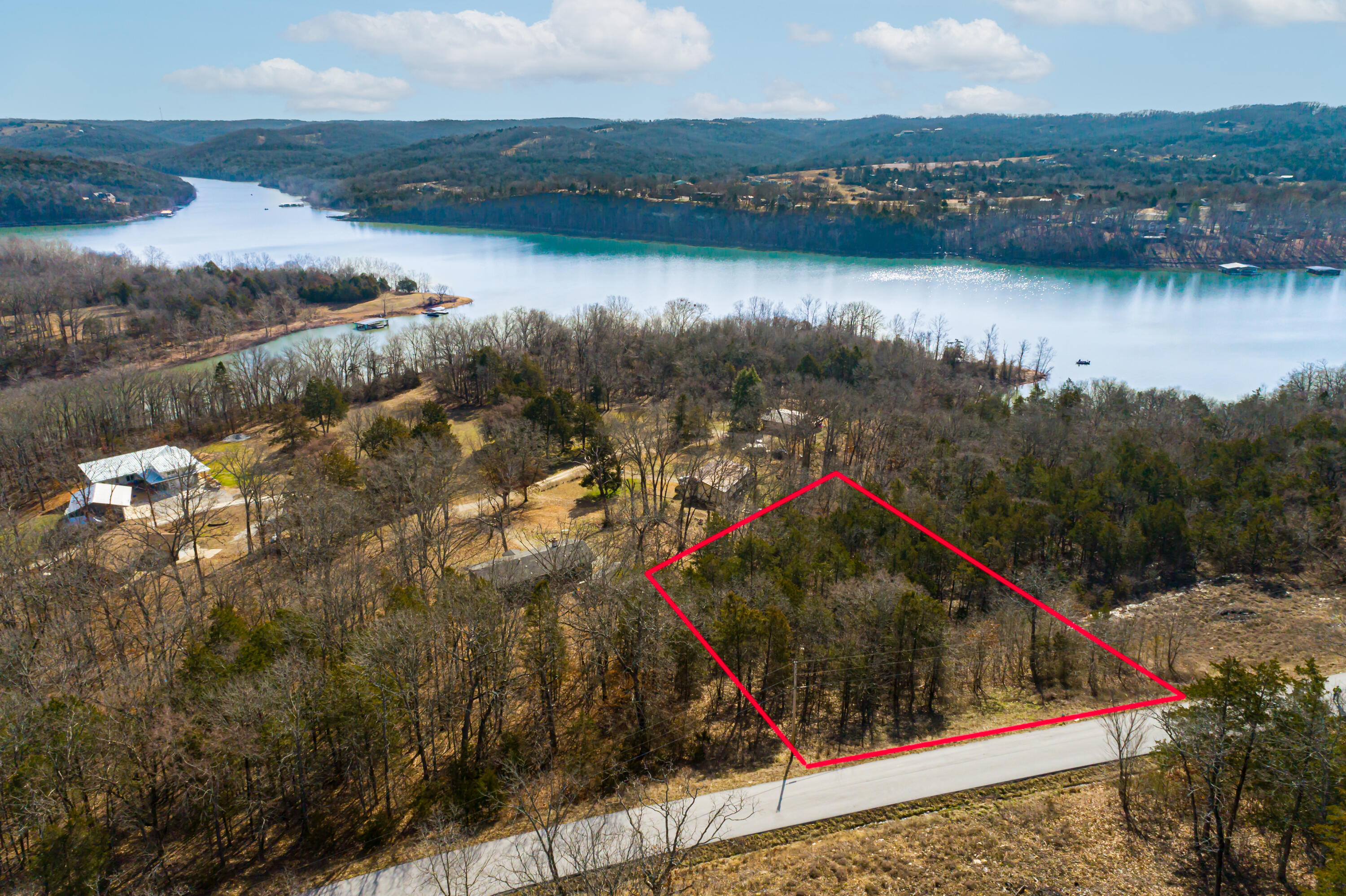 Beautiful lot in Country Time Estates just waiting for you to build your forever LAKE HOME. Amazing views of Table Rock Lake and the Virgin Bluff. Cape Fair Marina is just around the corner, and the famous FLAT CREEK RESTAURANT is just down the road.Branson attractions minutes away.