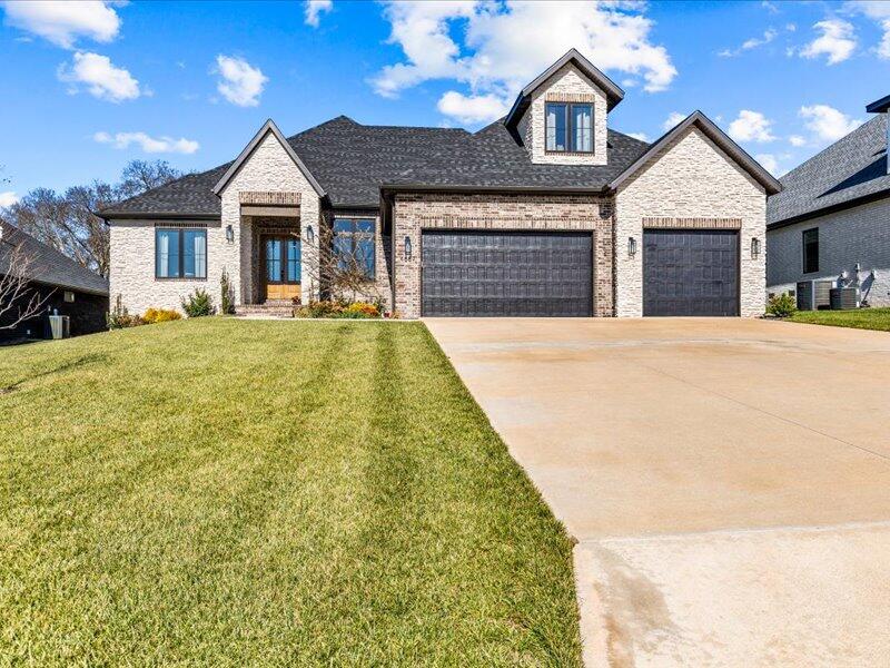 Introducing an exquisite 3,500 sqft all-brick and stone home, nestled within the gated community of Forest Trails Subdivision on the east side and conveniently close to the Hickory Hills country club, featuring 5 bedrooms, 3.5 baths, & a generous three-car garage. The master suite is a true retreat on its own, offering a walk-in closet, walk-in shower, soaking tub, double vanity sinks, and ample space for your relaxation. The kitchen includes quartz counters, white cabinets, and a stained island. With custom cabinetry, hardwood flooring, a spacious screened in back deck, 4 ft wooden fencing surrounding the backyard, and meticulously landscaped grounds, this home offers a serene and stylish living experience. It comes equipped with a water softener, energy-efficient appliances and lighting, and the convenience of an HOA covering trash service and common area maintenance. This is one of the only homes available in this area right now, and it won't last long!