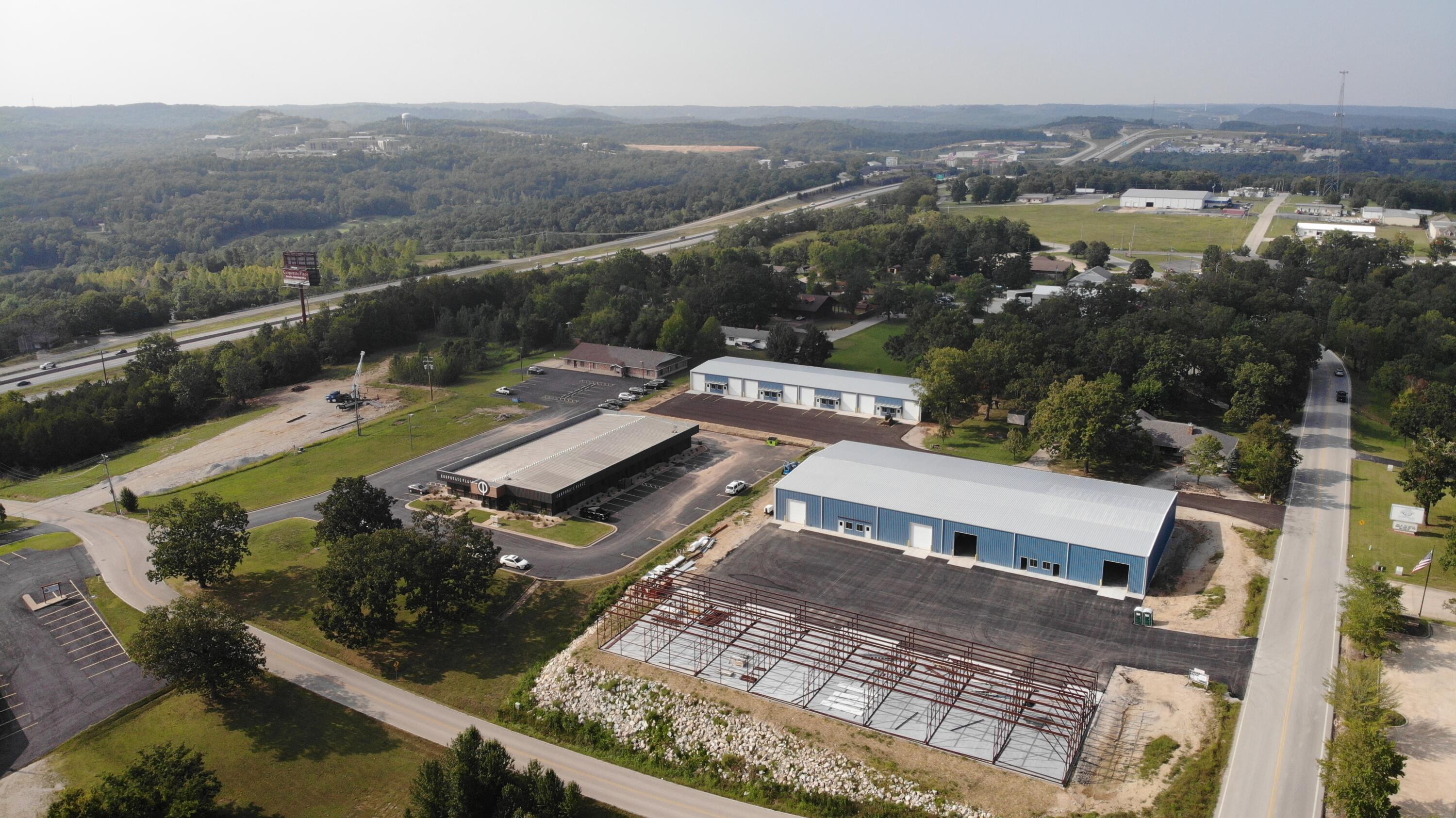 Investor opportunity! Under construction now! Three office/warehouse buildings totaling 44,000 Sq Ft!  Building 1 is 20,000 SqFt, with 4 bays and 18' ceilings.  Building 2 and Building 3 are each 12,000 sq ft with 8 bays, each with a 12' overhead door and a walkthrough door.  Demand for warehouse space has been through the roof and rents have been rising! This new project satisfies ongoing demand in the marketplace for office/warehouse. Slated for completion December 2023, this could even meet the timeline for your 1031 exchange! It's a great time to diversify your holdings. Excellent location on North side of Branson. Quick access to Hwy 65. Also available for purchase individually. MLS #60234231 for Bldg 1, MLS #60236158 for Bldg 2 and MLS #60234229 for Bldg 3.