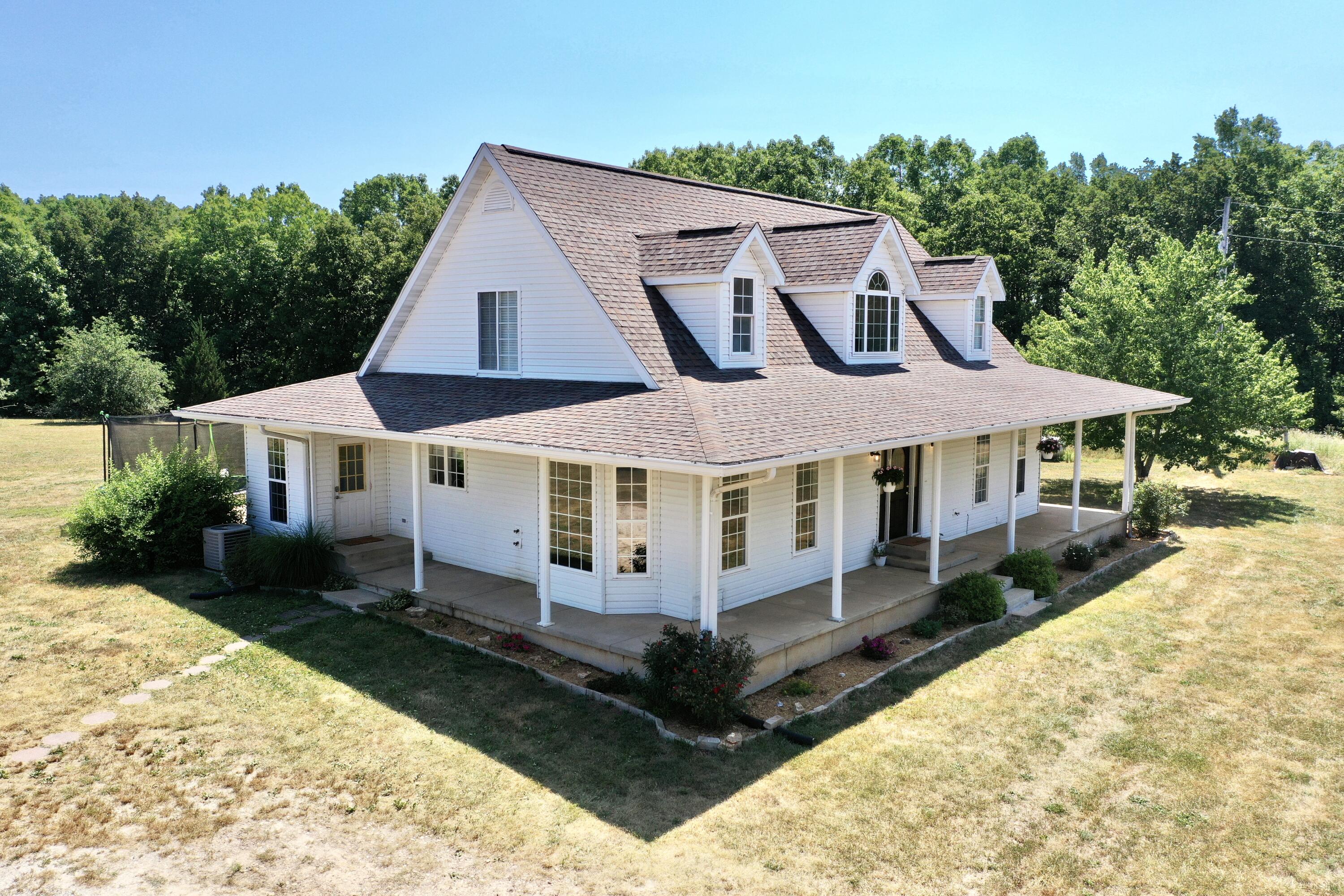 Huge price reduction!Motivated seller!Beautiful secluded, modern day farmhouse sitting on the perfect combination of woods/pasture has everything you are looking for! Home is surrounded by thousands of acres of National Forest and minutes away from the North Fork river!25 acres with a perimeter fence and partial cross fencing, 30x40 shop, transfer switch set up to hardwire a generator,  fruit trees, and an actively producing garden!Home features wrap around porch, hardwood floors, large mudroom/laundry room, updated kitchen cabinets and fixtures throughout. Formal dining room and kitchen nook, sunroom/office space, large master suite on the main level with walkout access to the porch.  Home has a 700+ sqft basement with a storm shelter/safe room. Basement is perfect for storage as well as additional storage space in the attic. This property is a must see! Call today for your private showing!