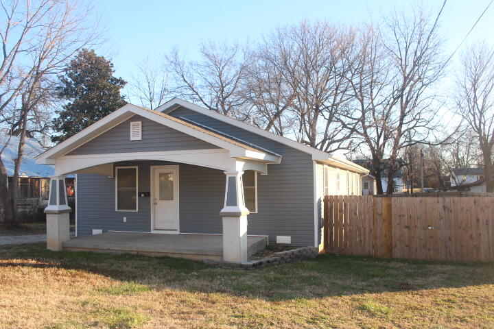 Super clean totally remodeled three bedroom, two bath home. Hardwood flooring throughout the home, arched door way dividing the huge family room and kitchen/dining room. The large utility room has vinyl flooring and door leading outside to a large back yard with privacy fence. The detached 22' x 25' detached garage may be used as one car garage or workshop.